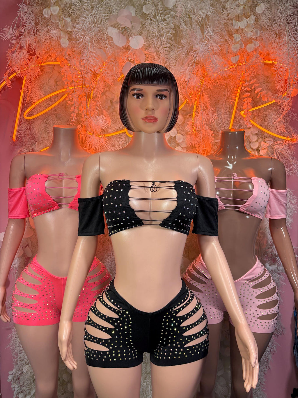 Black rhinestone rave outfit with off-shoulder top and jeweled cutout shorts