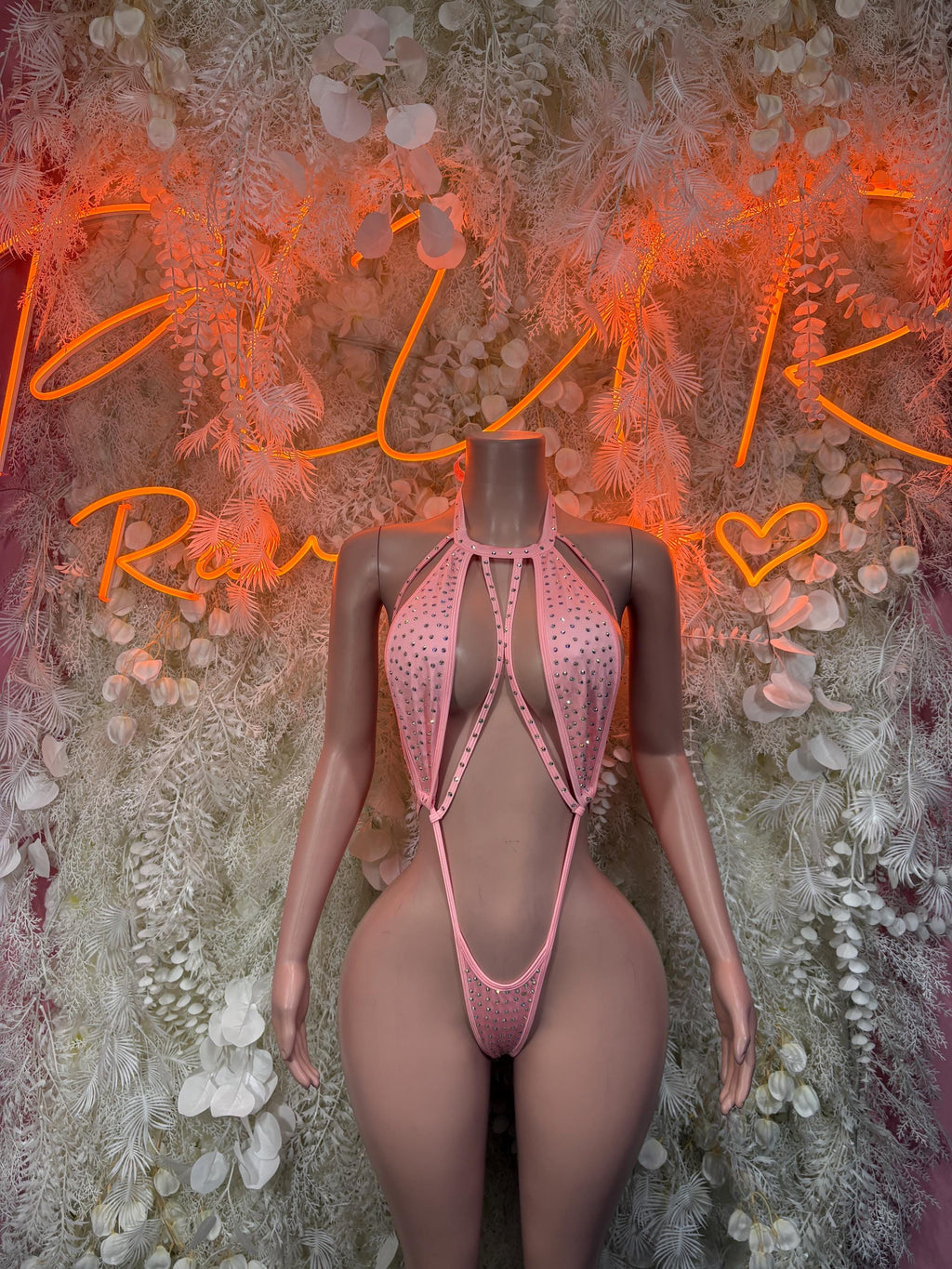 Pink rhinestone halter bodysuit with strappy cutouts and thong back, one-piece