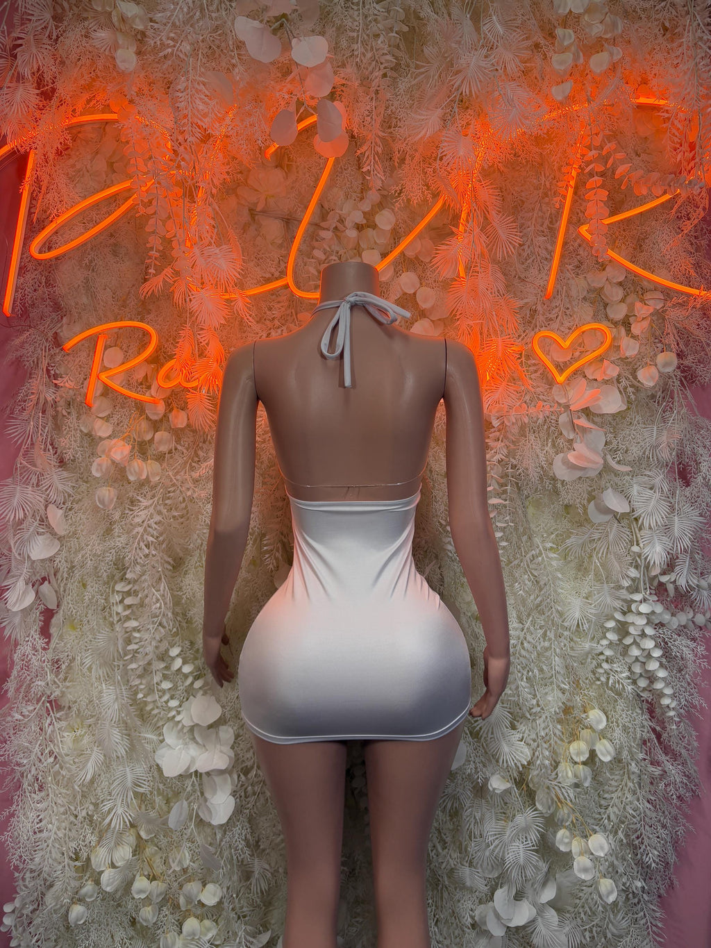 White halter mini bodycon dress, back view with neck tie bow