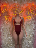 Burgundy sleeveless rave bodysuit with sweetheart neckline and high-cut leg