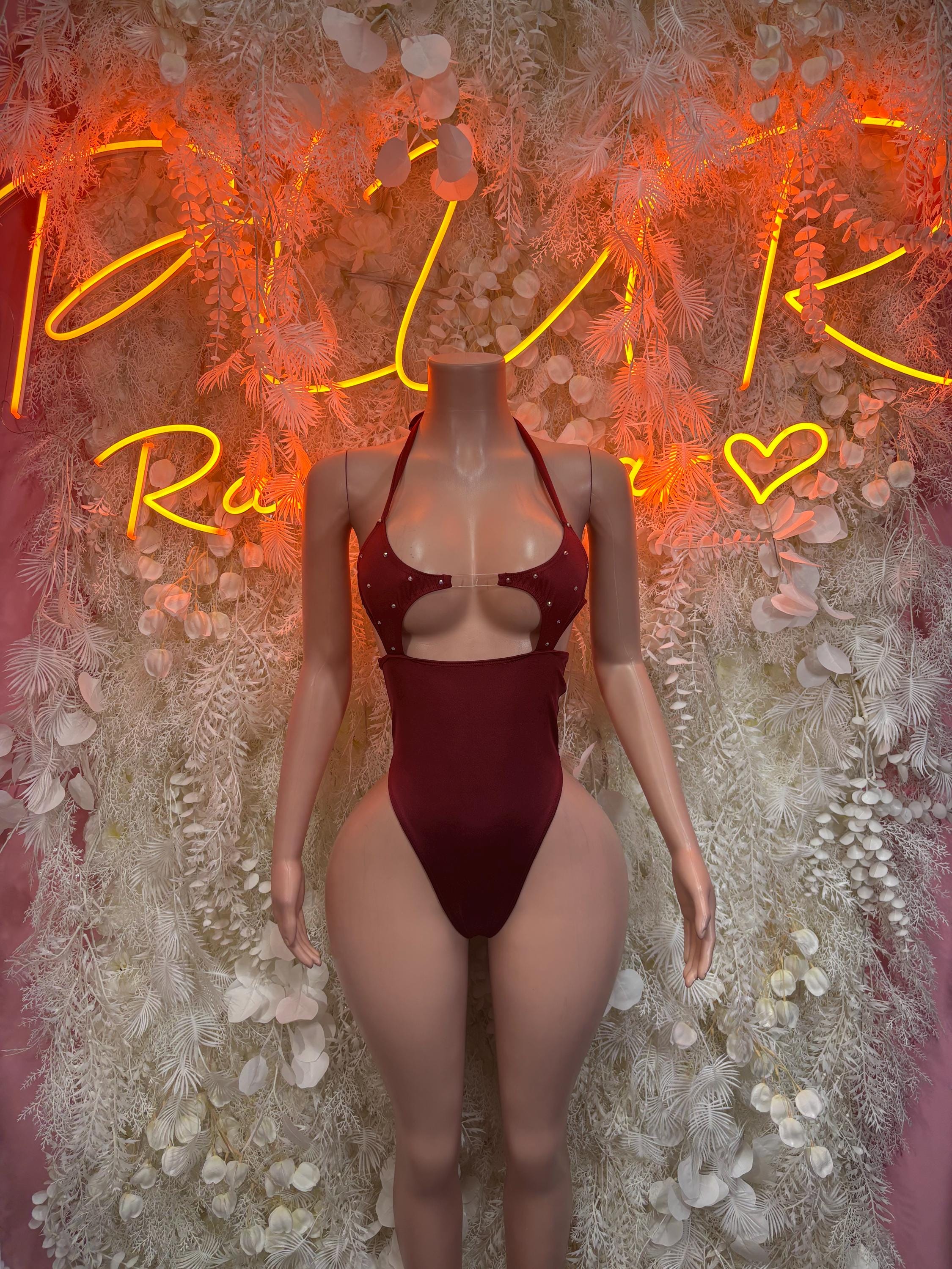 Burgundy sleeveless rave bodysuit with sweetheart neckline and high-cut leg