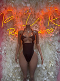 One-piece festival bodysuit, black with thong-cut legs and strappy front detail