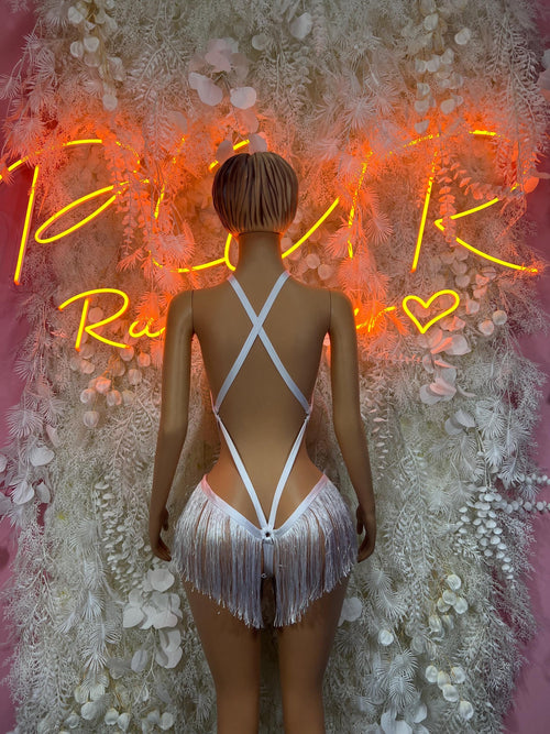 White two-piece rave costume, back view: cross straps and silver fringe tassels