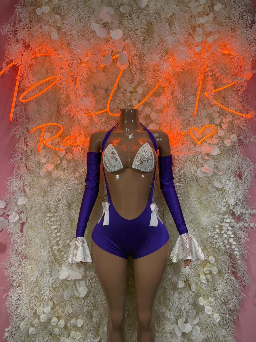 Purple ruffled-sleeve rave bodysuit with lace-trim triangle cups and front bow