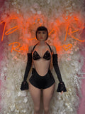 Black lace one-piece with deep V neckline, long sheer sleeves and heart trim