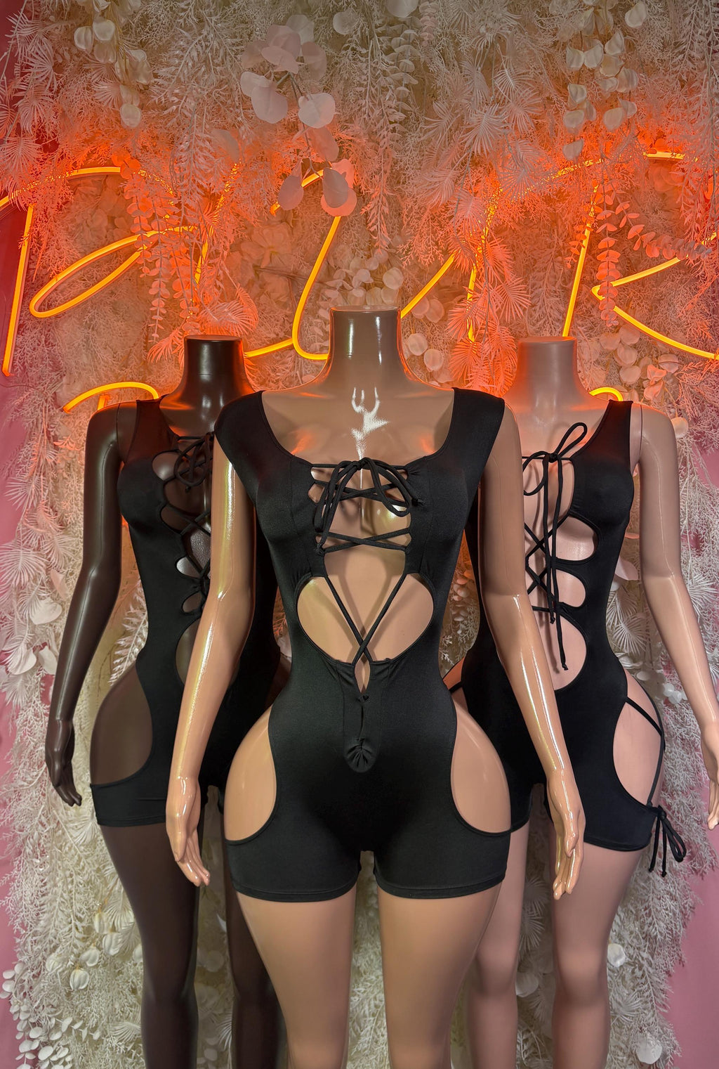 Black rave bodysuit with lace-up front, strappy cutouts, sleeveless one-piece