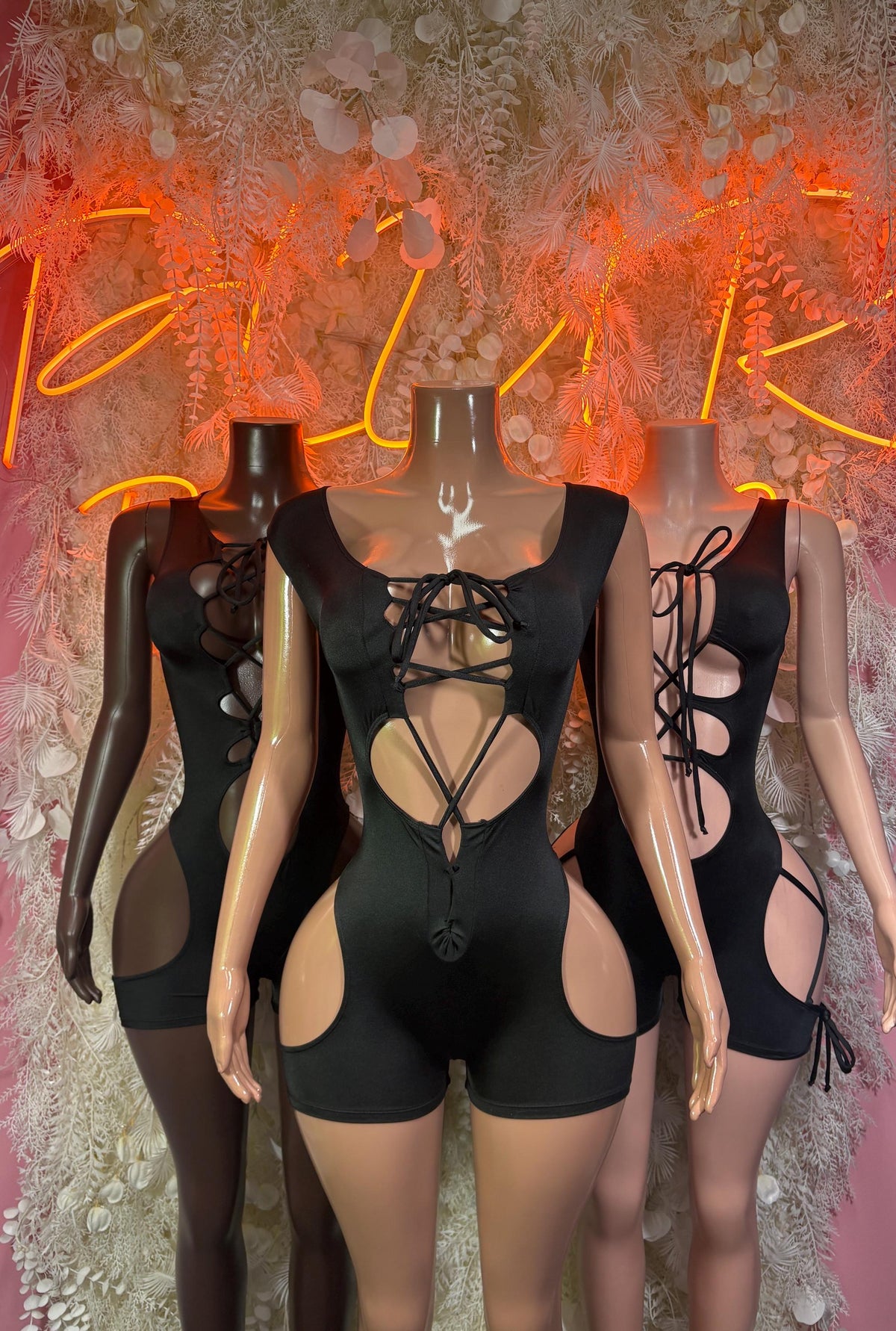 Black rave bodysuit with lace-up front, strappy cutouts, sleeveless one-piece