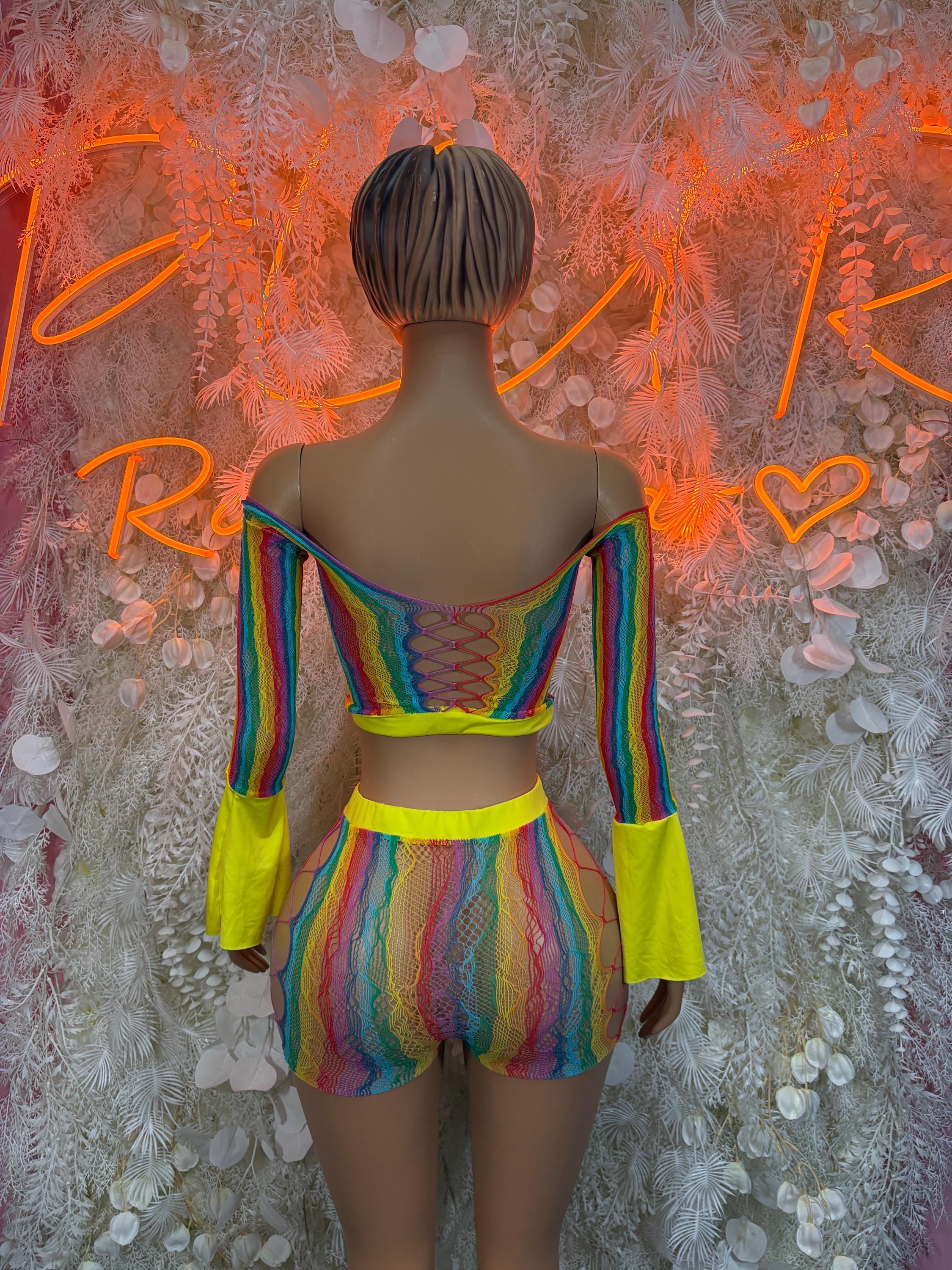 Back view rainbow iridescent fishnet romper with bell sleeves and neon waist trim