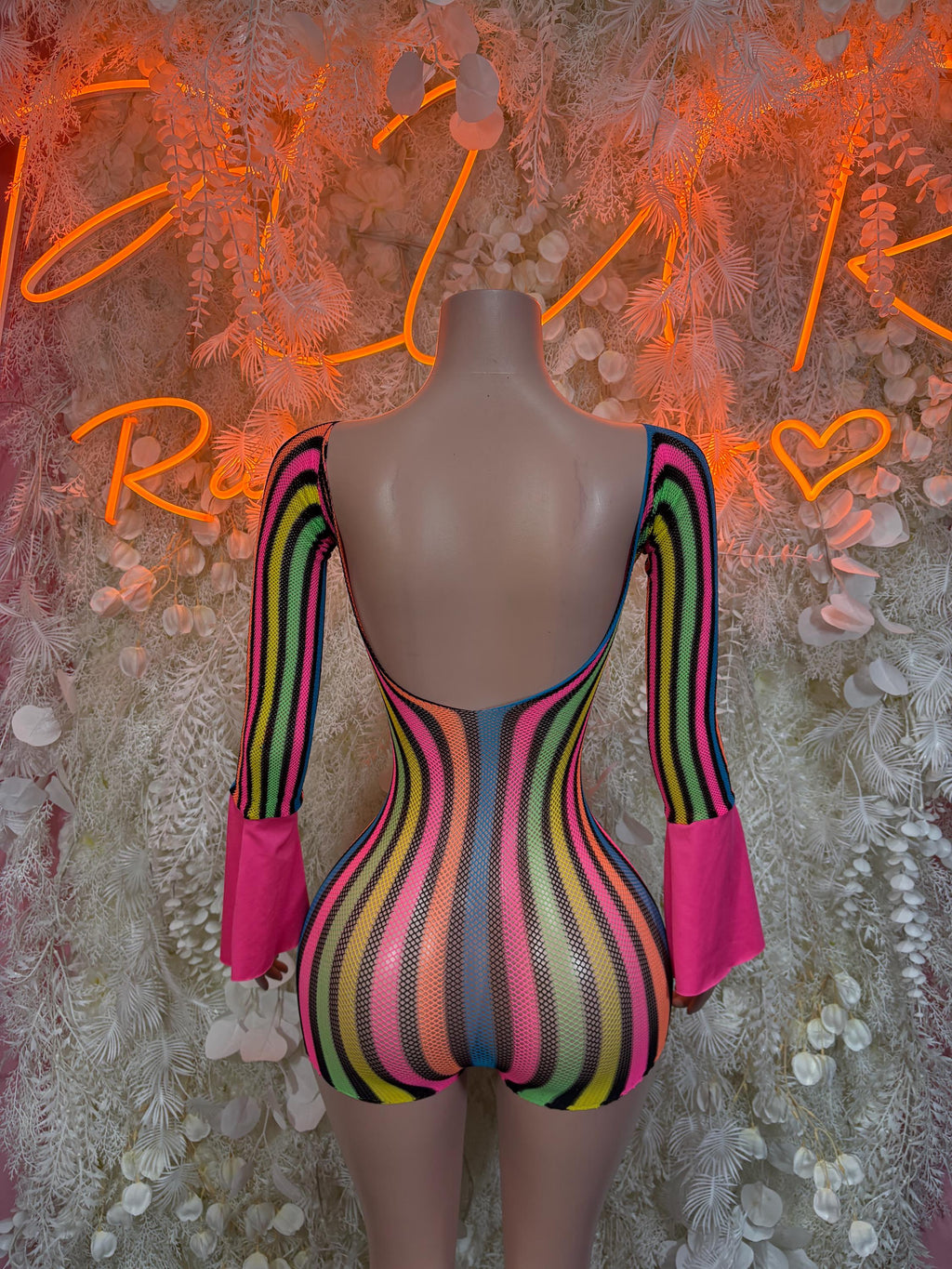Multicolor striped one-piece romper with back cutout and long flared sleeves
