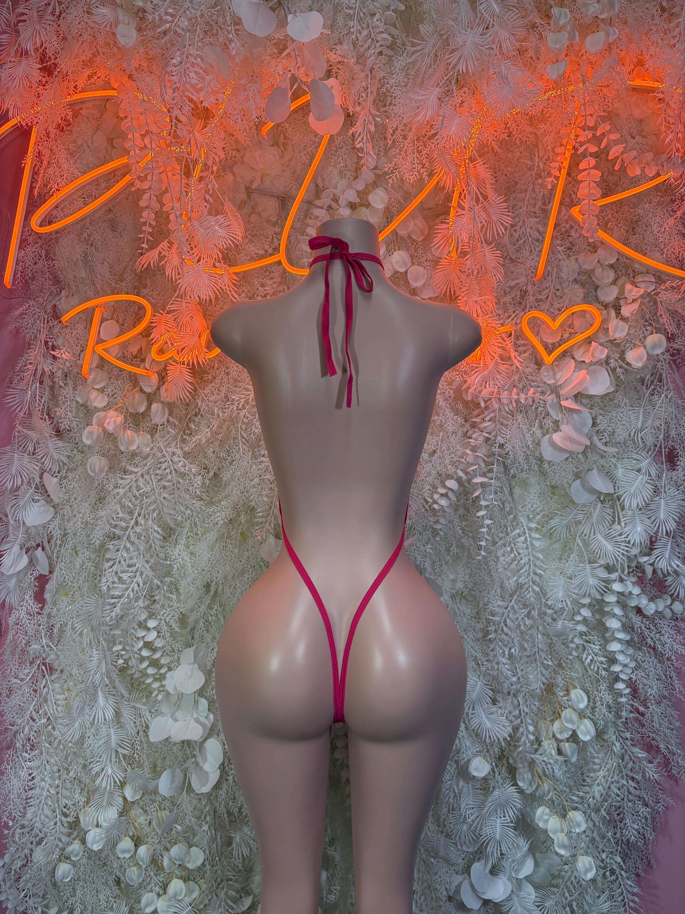 Pink lace slingshot bodysuit with back bow tie and high-leg V back