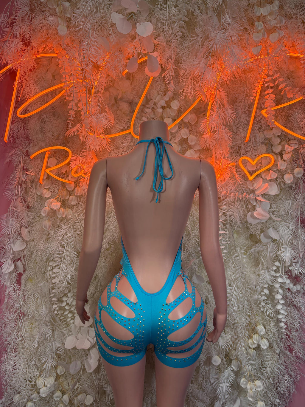 Blue rhinestone one-piece bodysuit with open back tie and strap cutouts