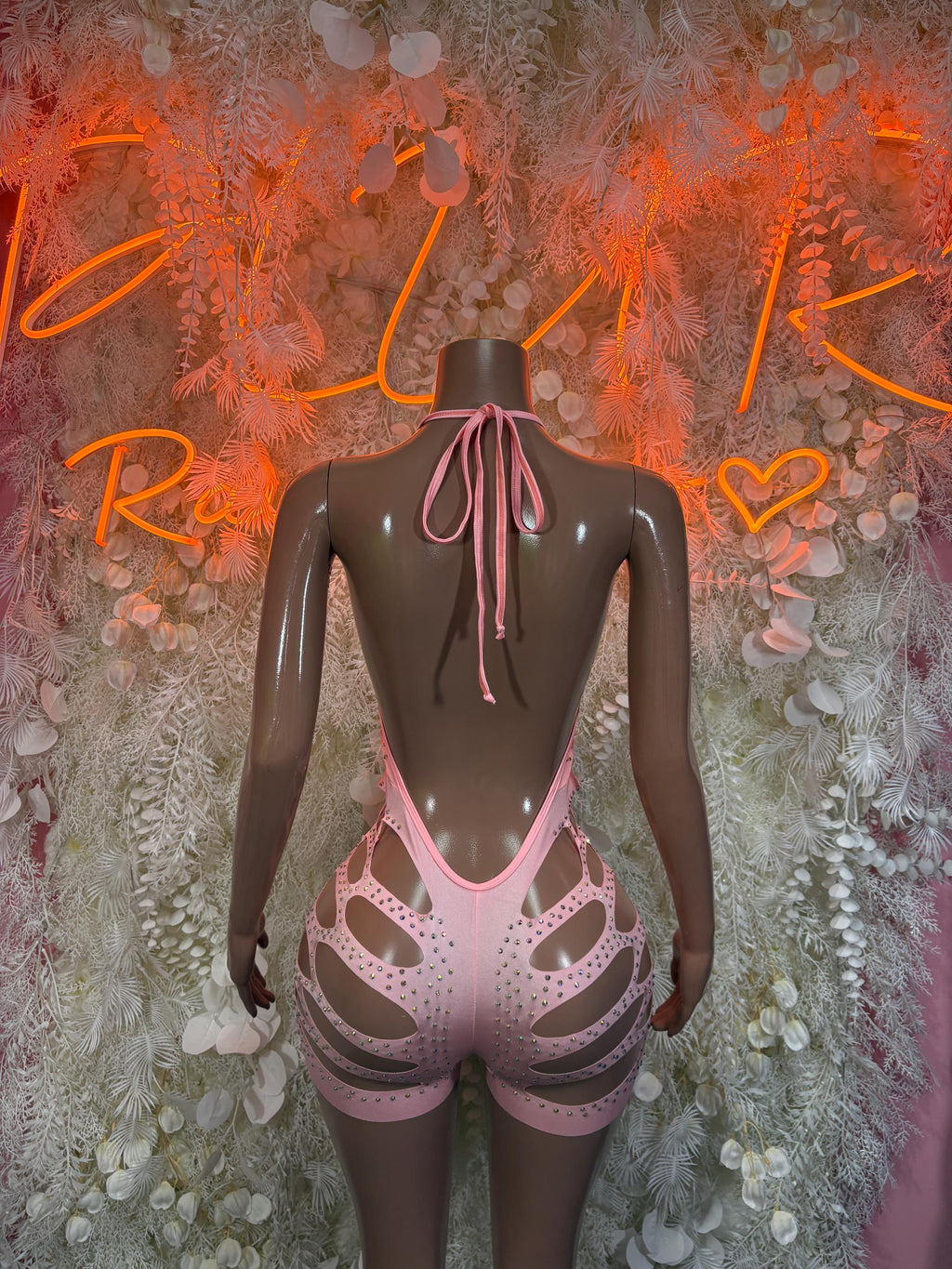 Pink rhinestone cutout bodysuit with crisscross back cutouts and tie straps