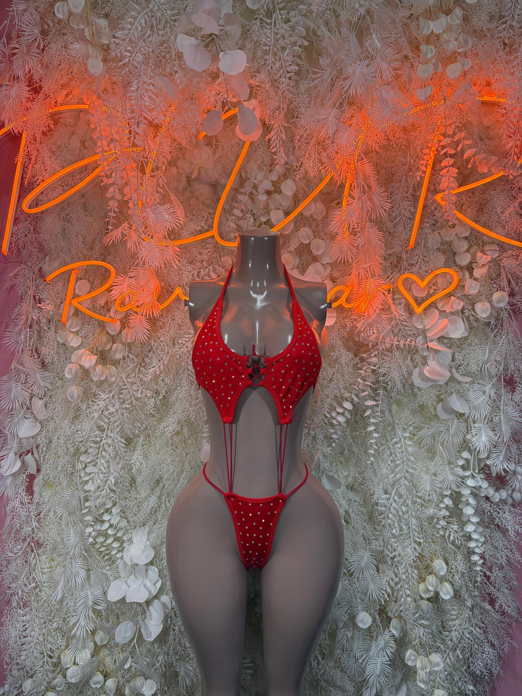 Red rhinestone one-piece festival bodysuit with halter neckline and cheeky cut