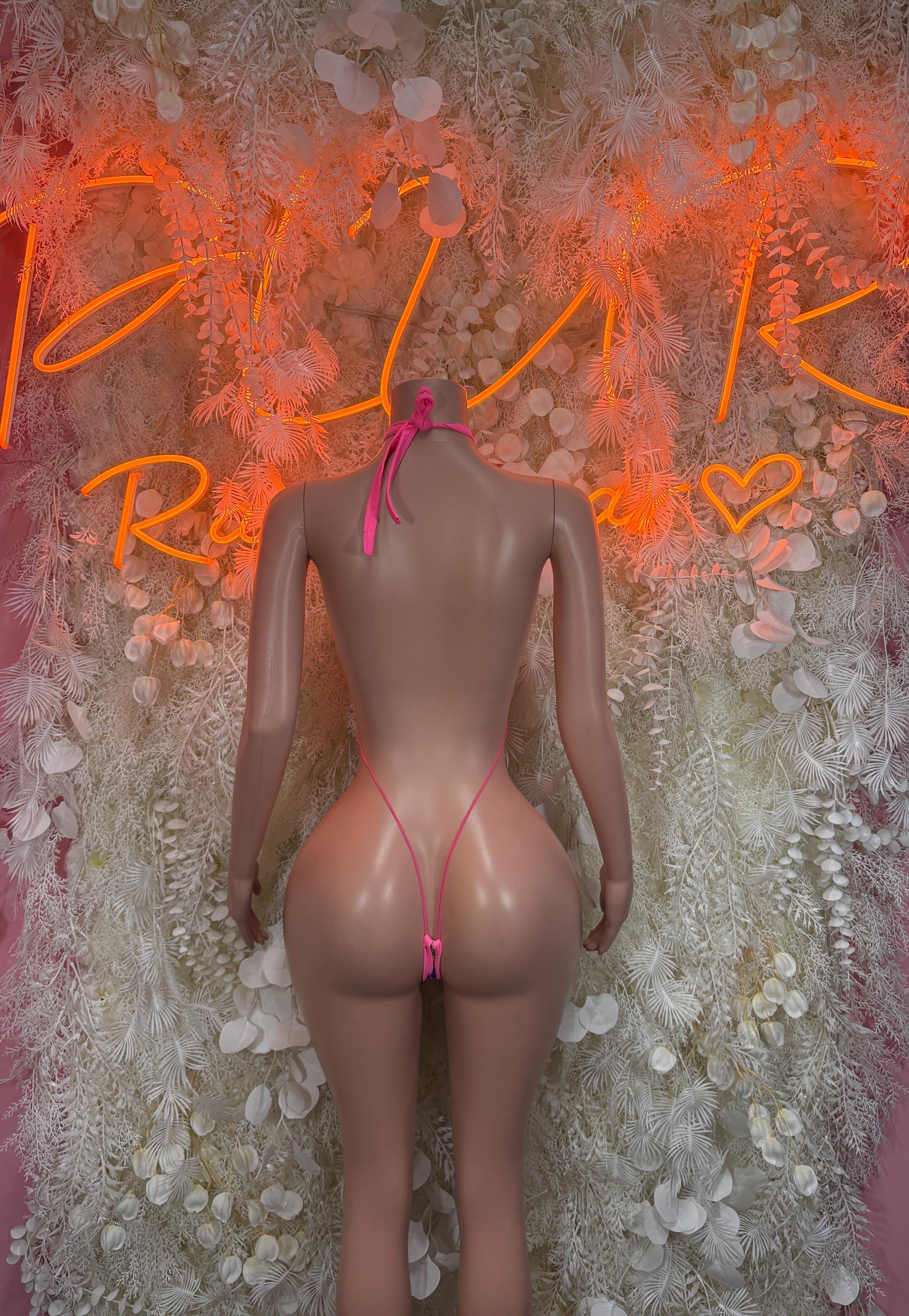Backless multicolor one-piece bodysuit with thin pink straps and open back cutouts