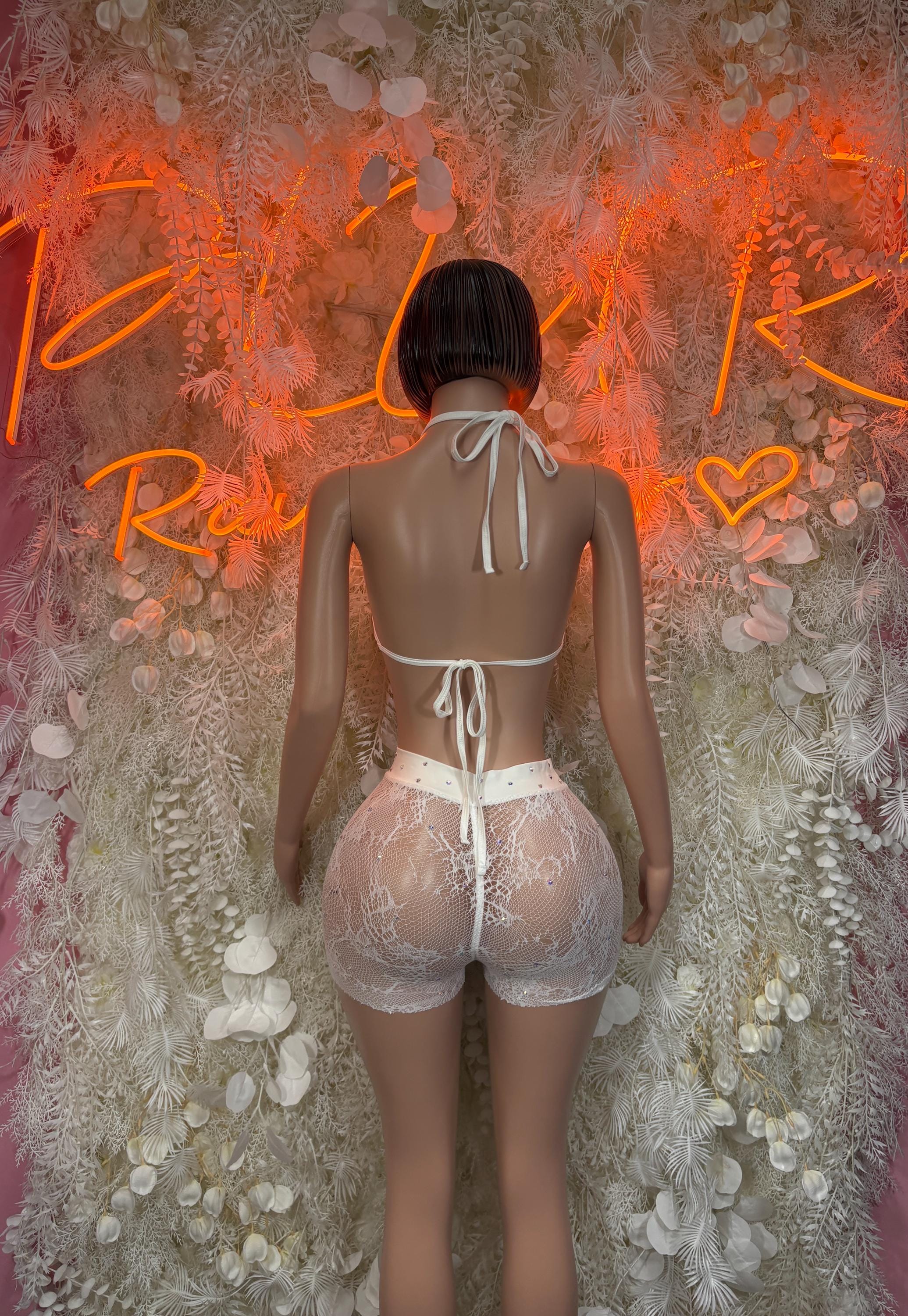 White rave two-piece bodysuit set, back view: halter ties and matching high-rise shorts