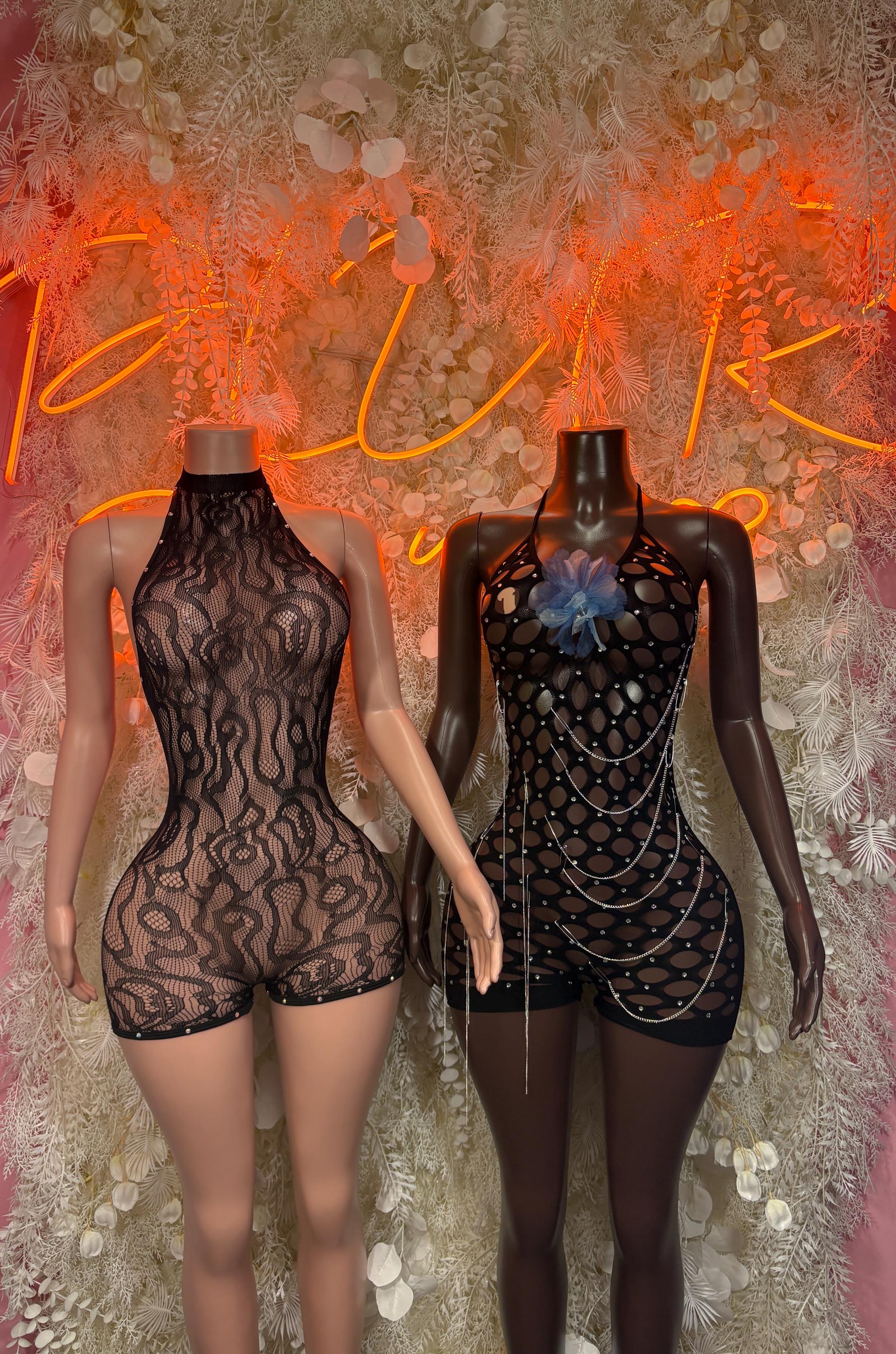 Black high-neck fishnet romper on two mannequins, front and open-back view