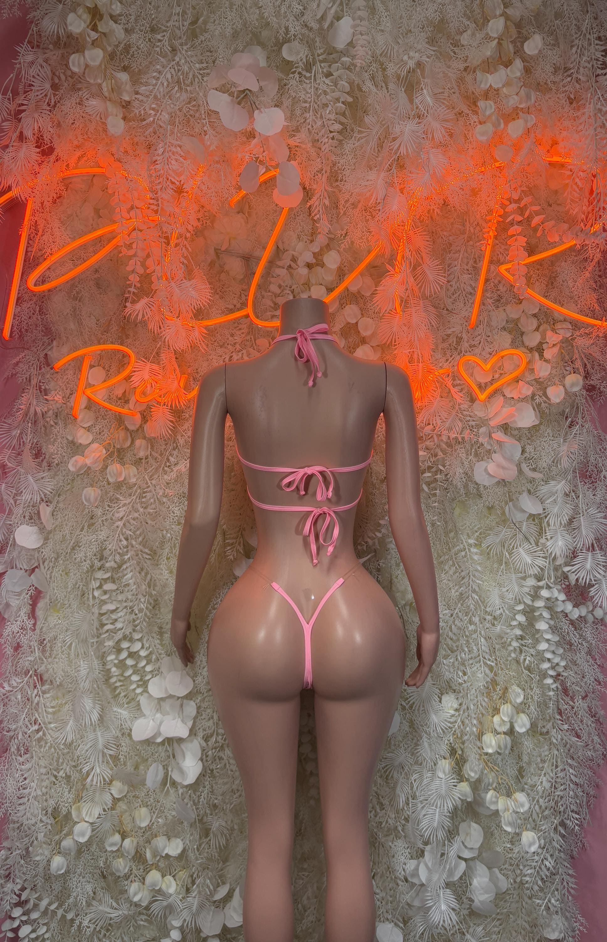 Pink rhinestone bikini with crisscross back and bow ties, matching thong bottoms