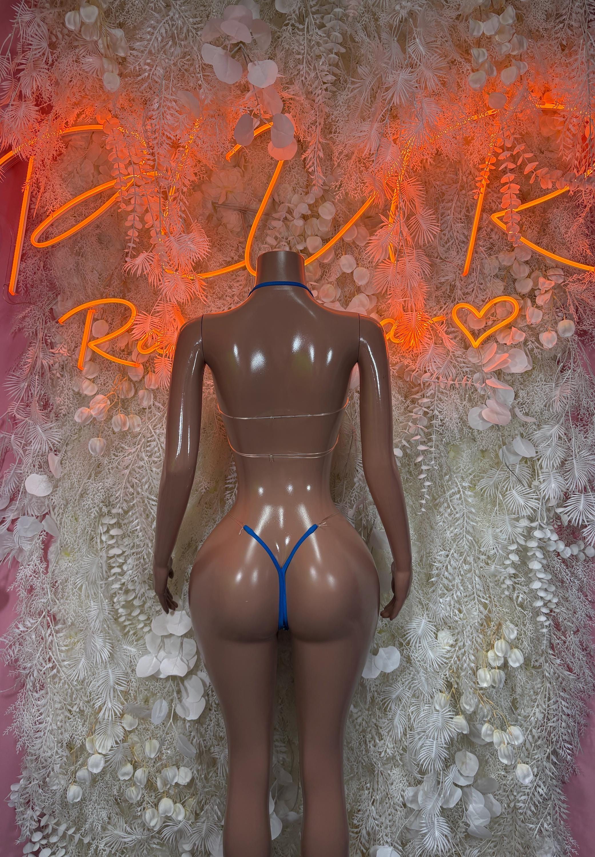 Two-piece bikini back view with blue rhinestone strap details and matching bottoms