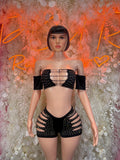 Black rhinestone two-piece bodysuit set with off-shoulder sleeves and strappy shorts