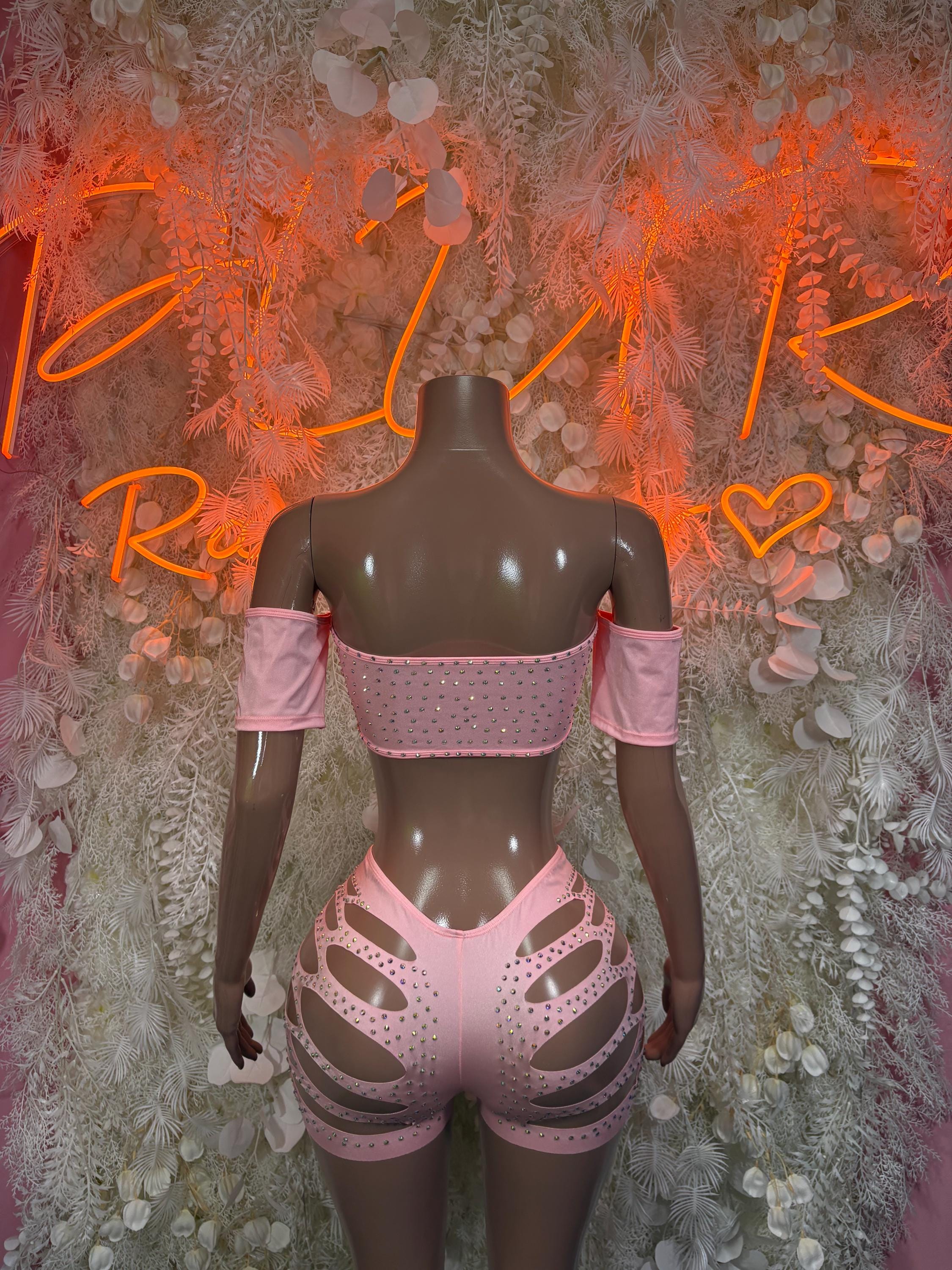 Pink rhinestone rave outfit back view with off-shoulder top and cutout shorts