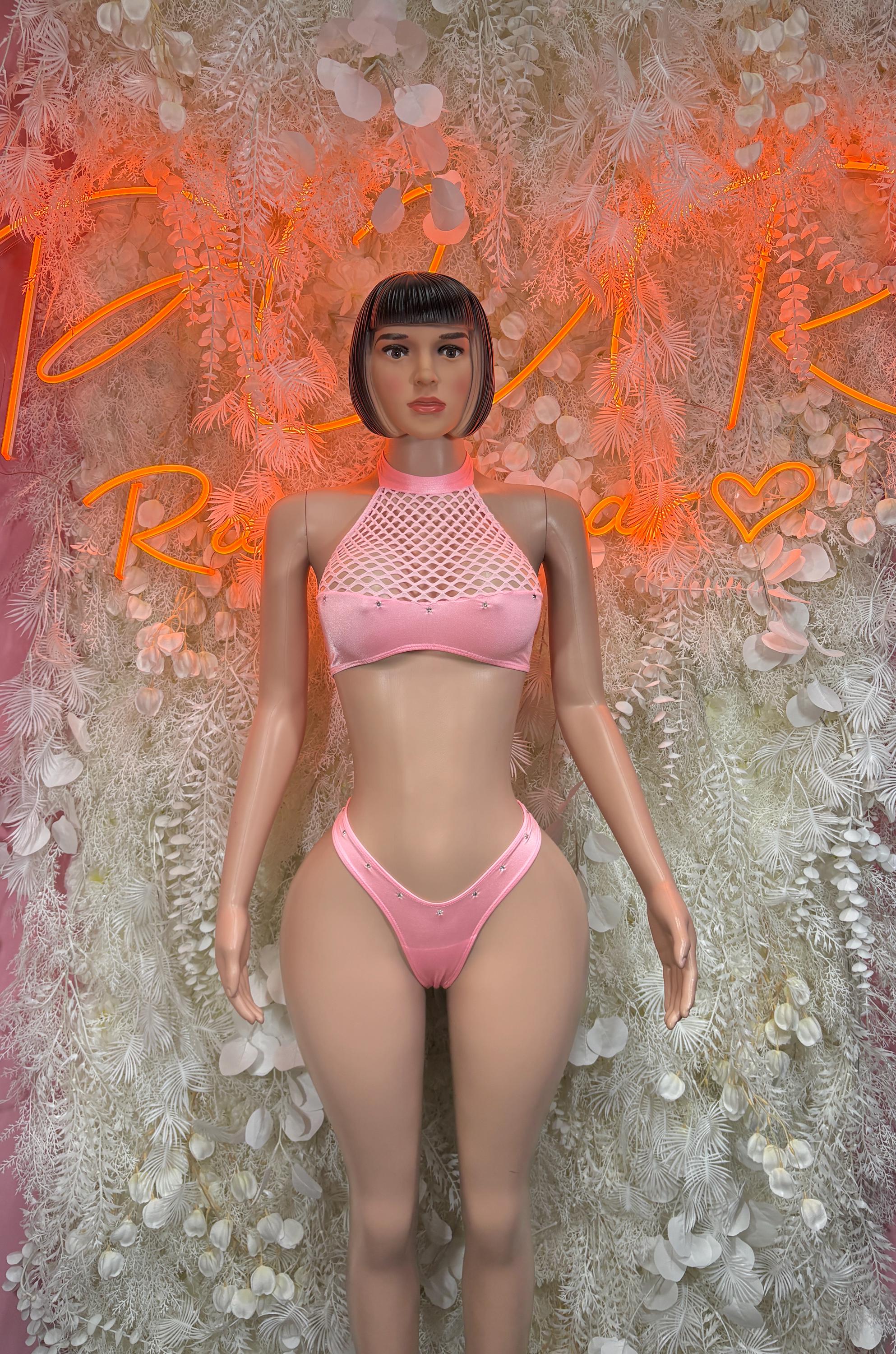 Pink two-piece festival outfit: mesh halter crop top and high-cut bikini bottoms