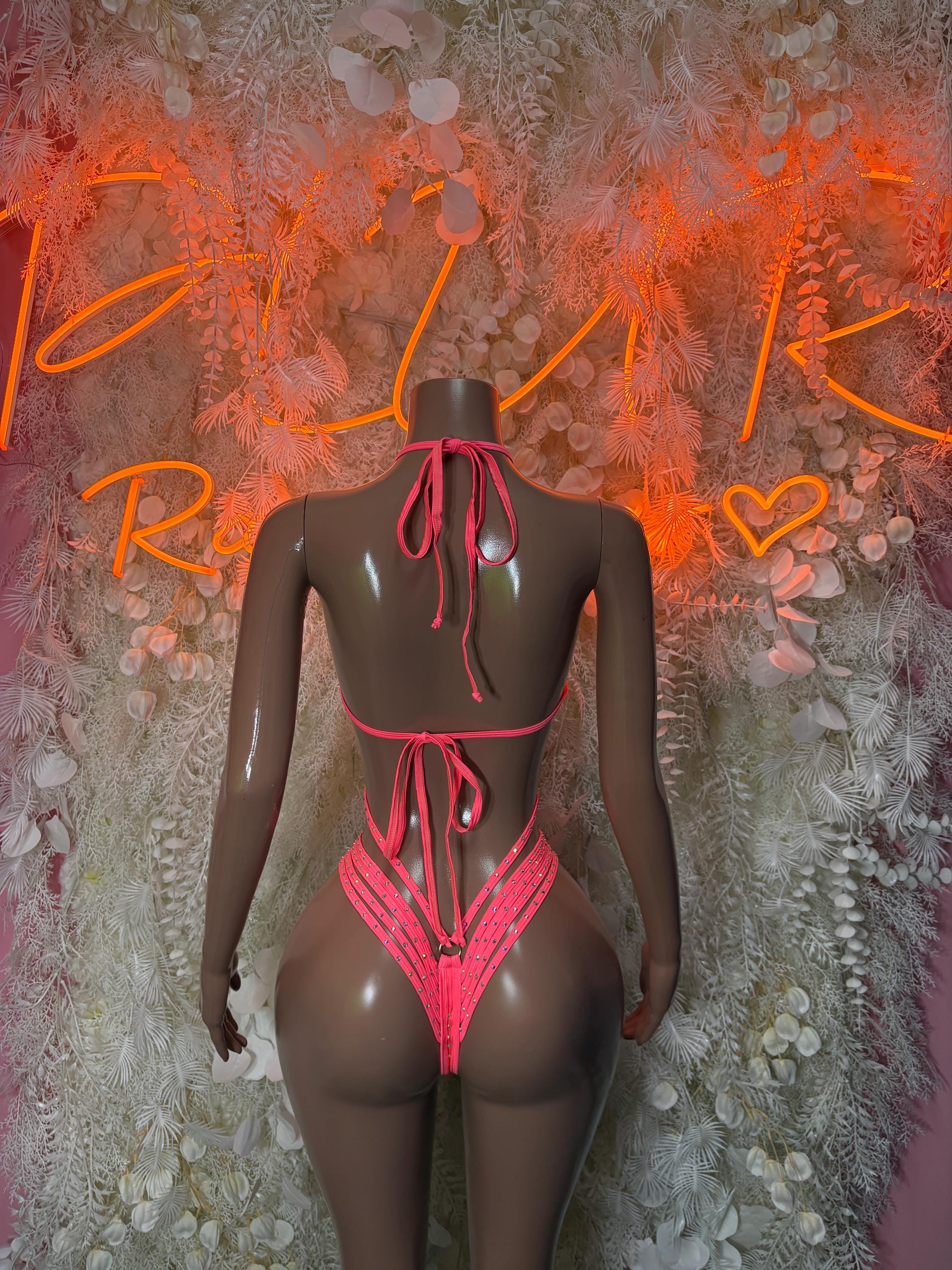 Coral rhinestone one-piece bodysuit, back with crisscross straps and tie closure