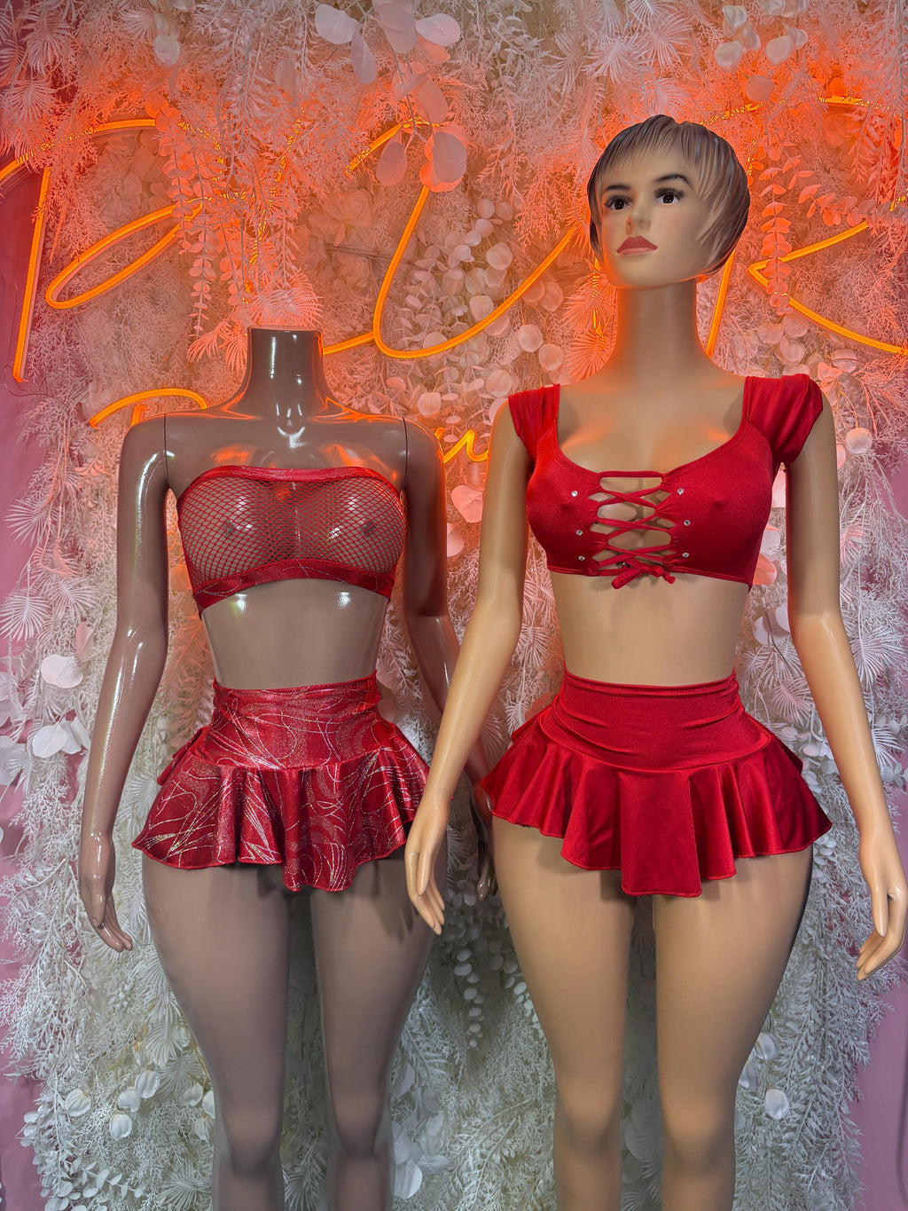 Red two-piece skirt set with lace-up mesh bra and ruffled mini skirt, front views