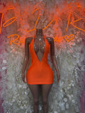 Orange sleeveless mini rave dress with deep V neckline and V-cut back