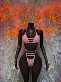 Pink slingshot-style costume with triangle bra and strappy high-cut bottoms