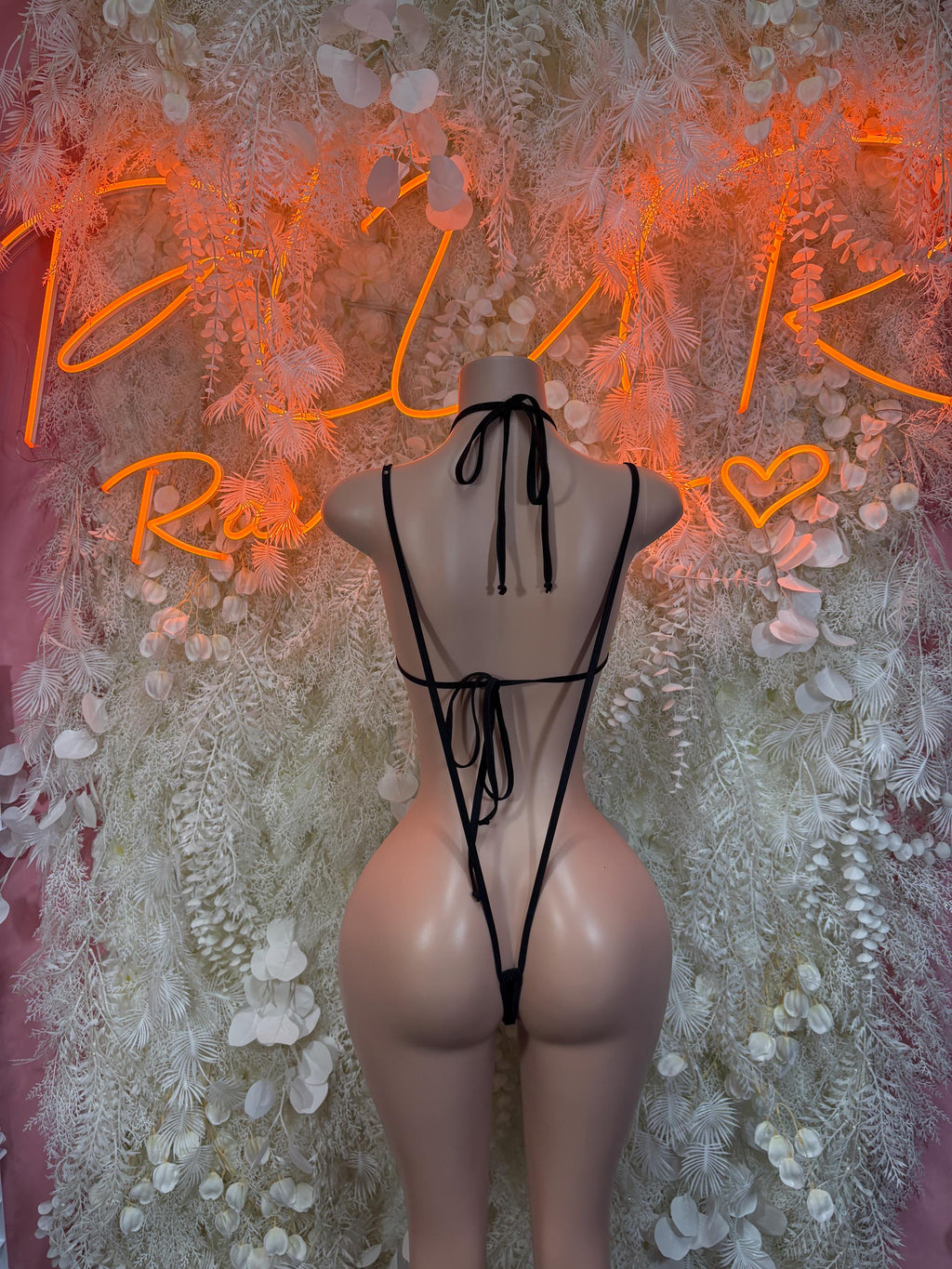Black strappy open-back rave bodysuit with tie halter back