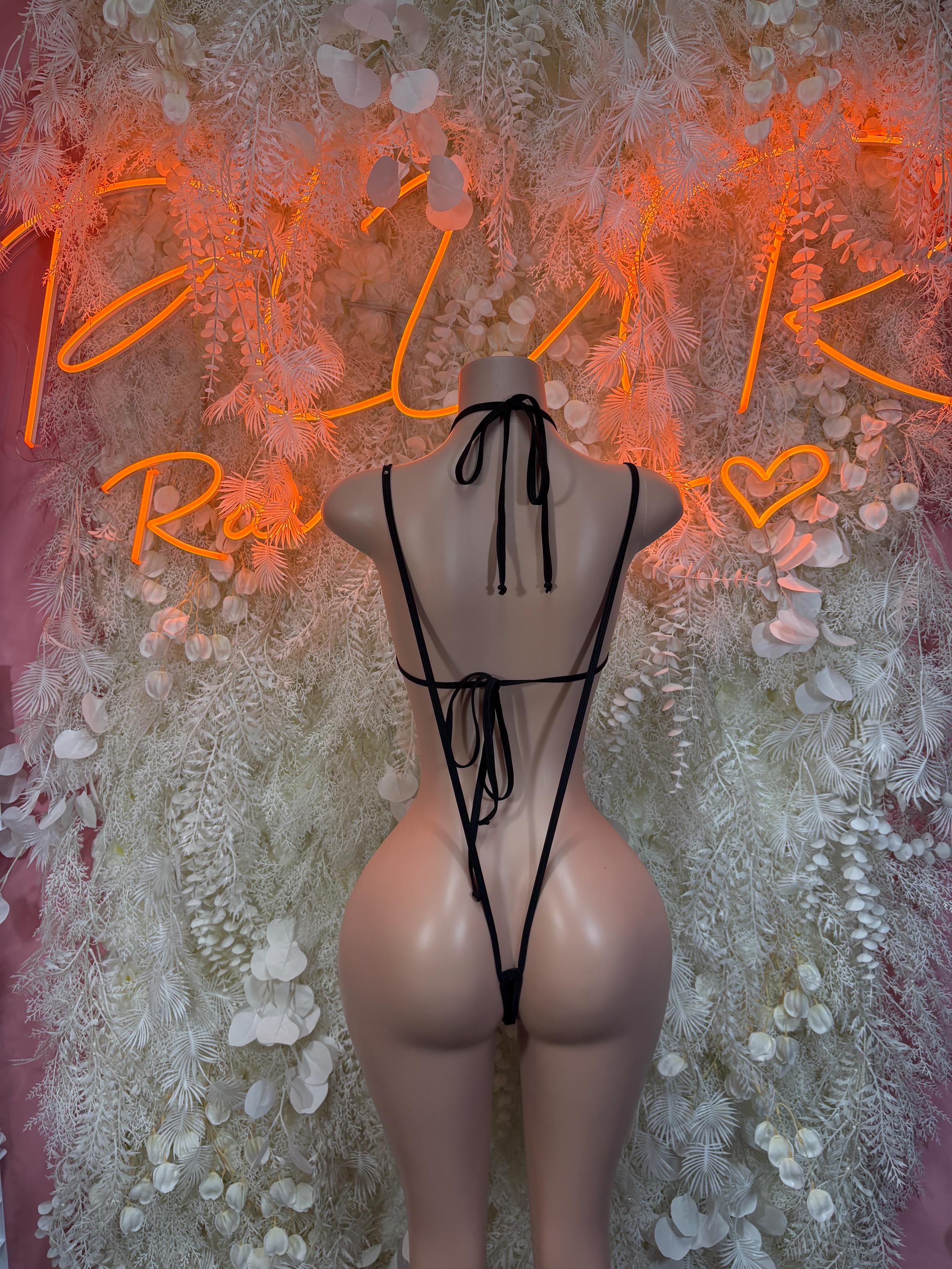 Black strappy open-back rave bodysuit with tie halter back