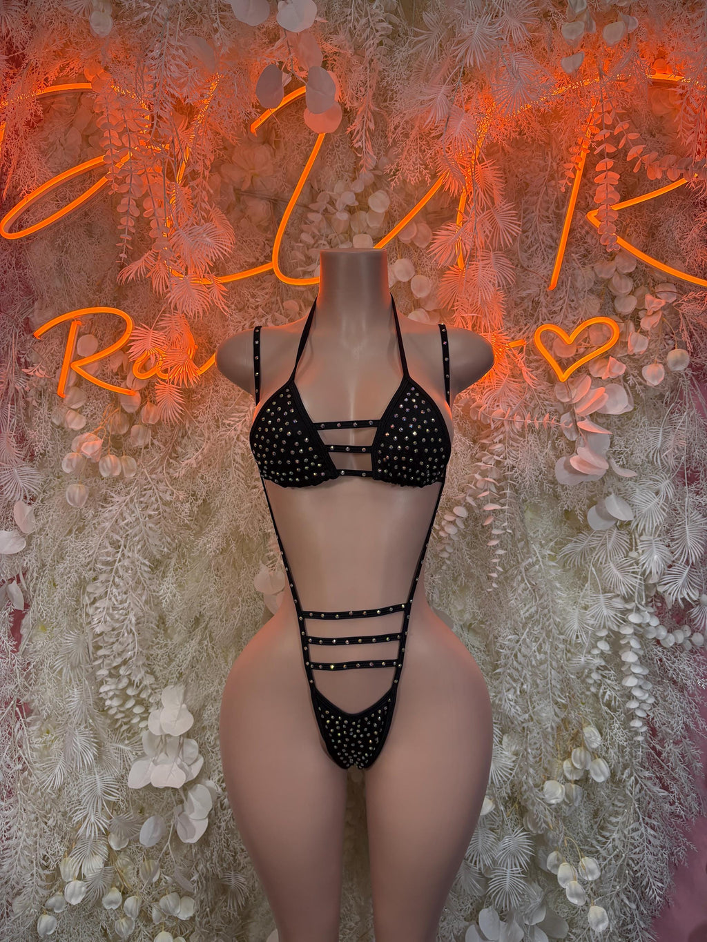 Black rhinestone rave bodysuit with strappy cutouts and halter top