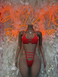 Red rhinestone rave two-piece set: triangle bra and high-cut thong with strappy waistband.