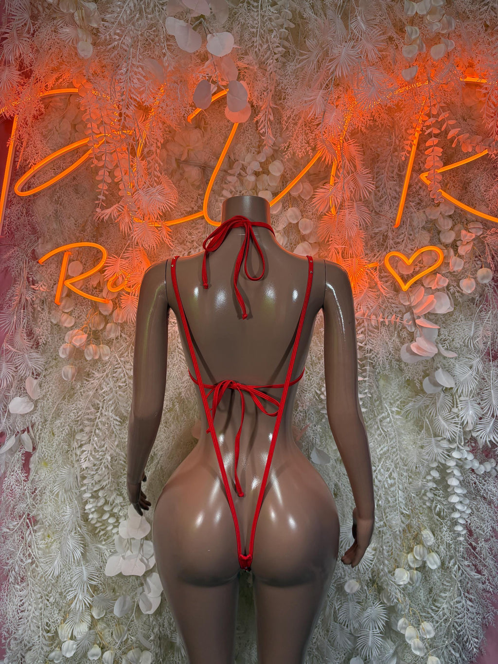 Red rhinestone two-piece set back view: tie-string thong and multi-strap leg bands.