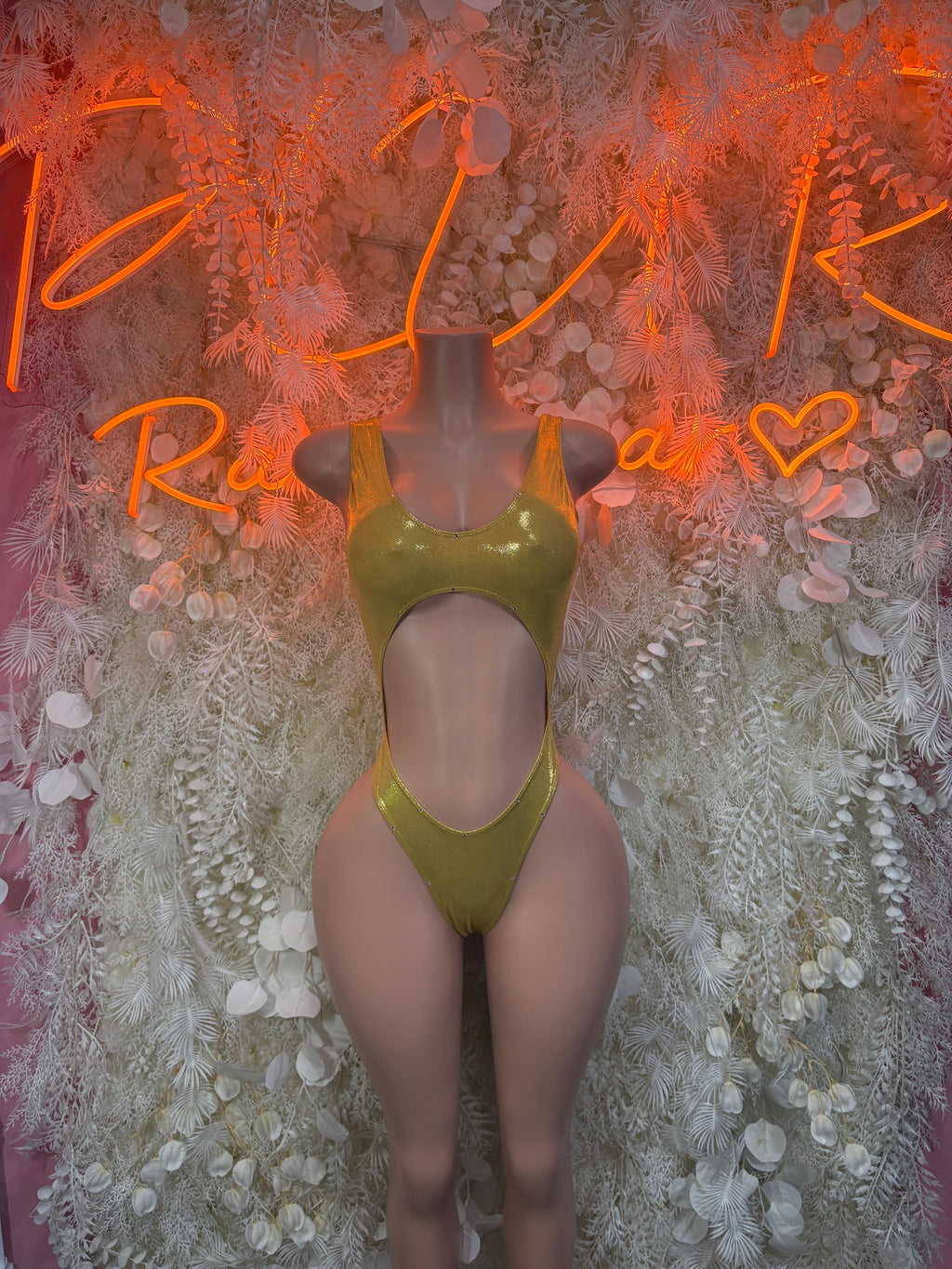 Gold rhinestone bodysuit with halter neckline and high-cut legs, front view