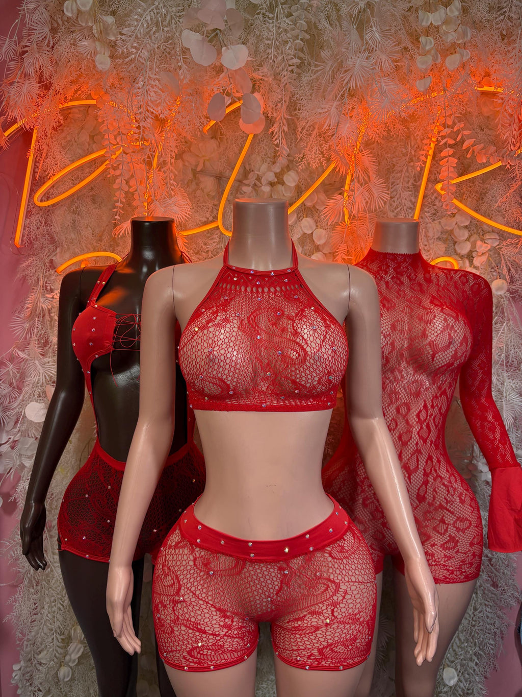 Red fishnet bodysuit with high-neck bra top and high-rise shorts, front view