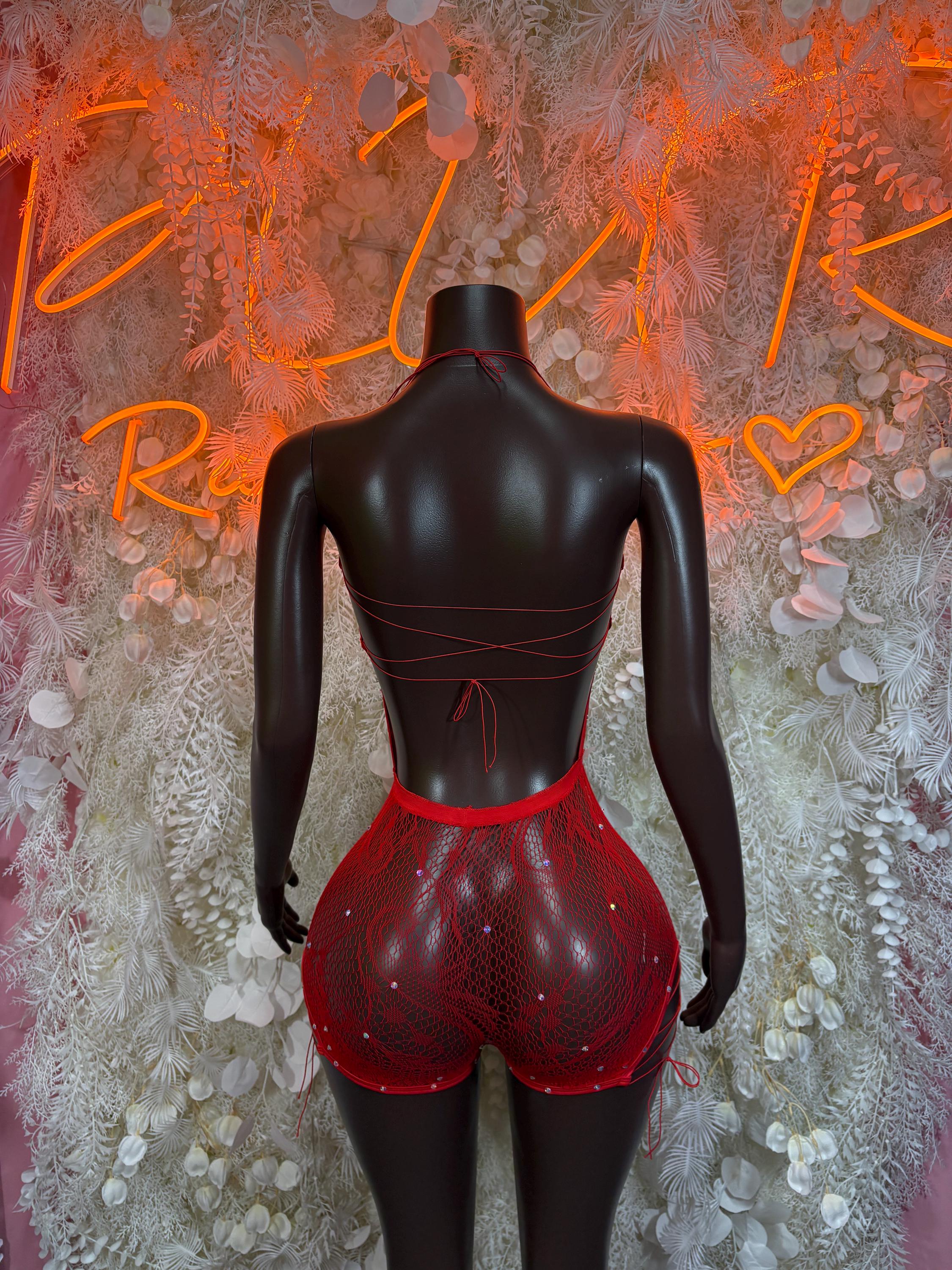 Red fishnet bodysuit with open-back panel and high-rise shorts, back view