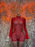 Red fishnet bodysuit with long sleeves, high neckline, fitted shorts
