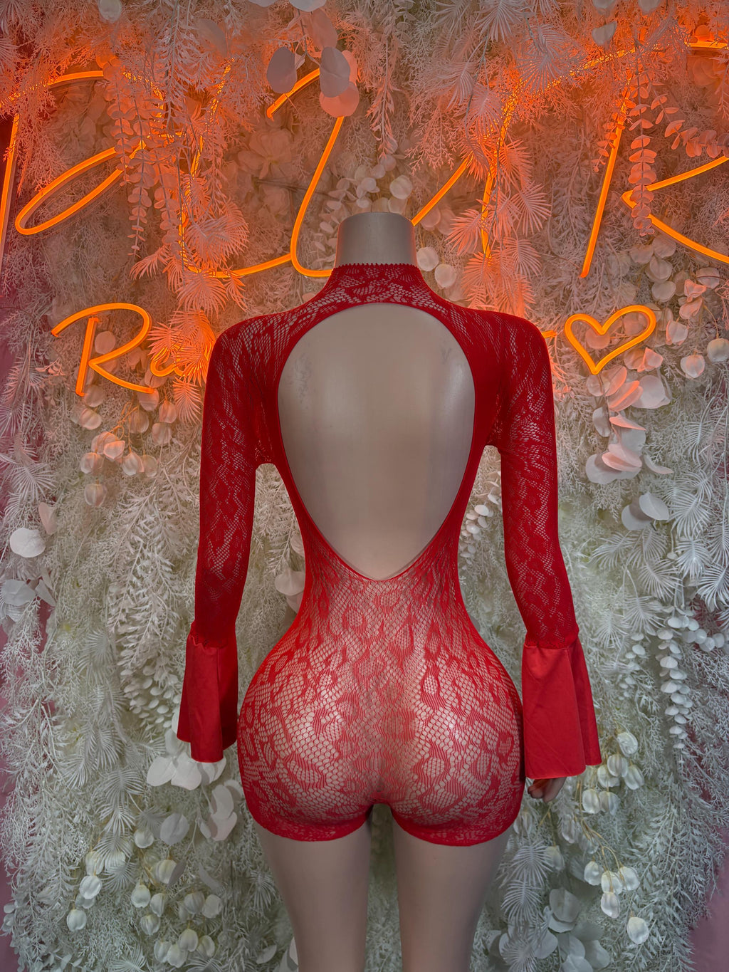 Red fishnet bodysuit with open back and long bell sleeves