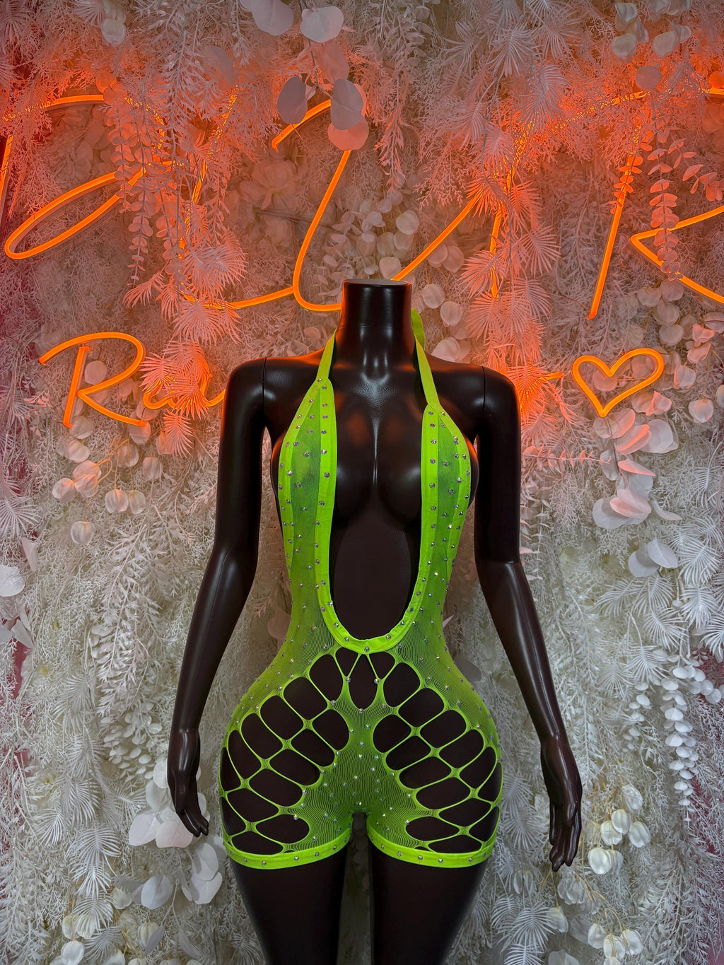 Green fishnet bodysuit with high scoop neckline and cutout thigh panels