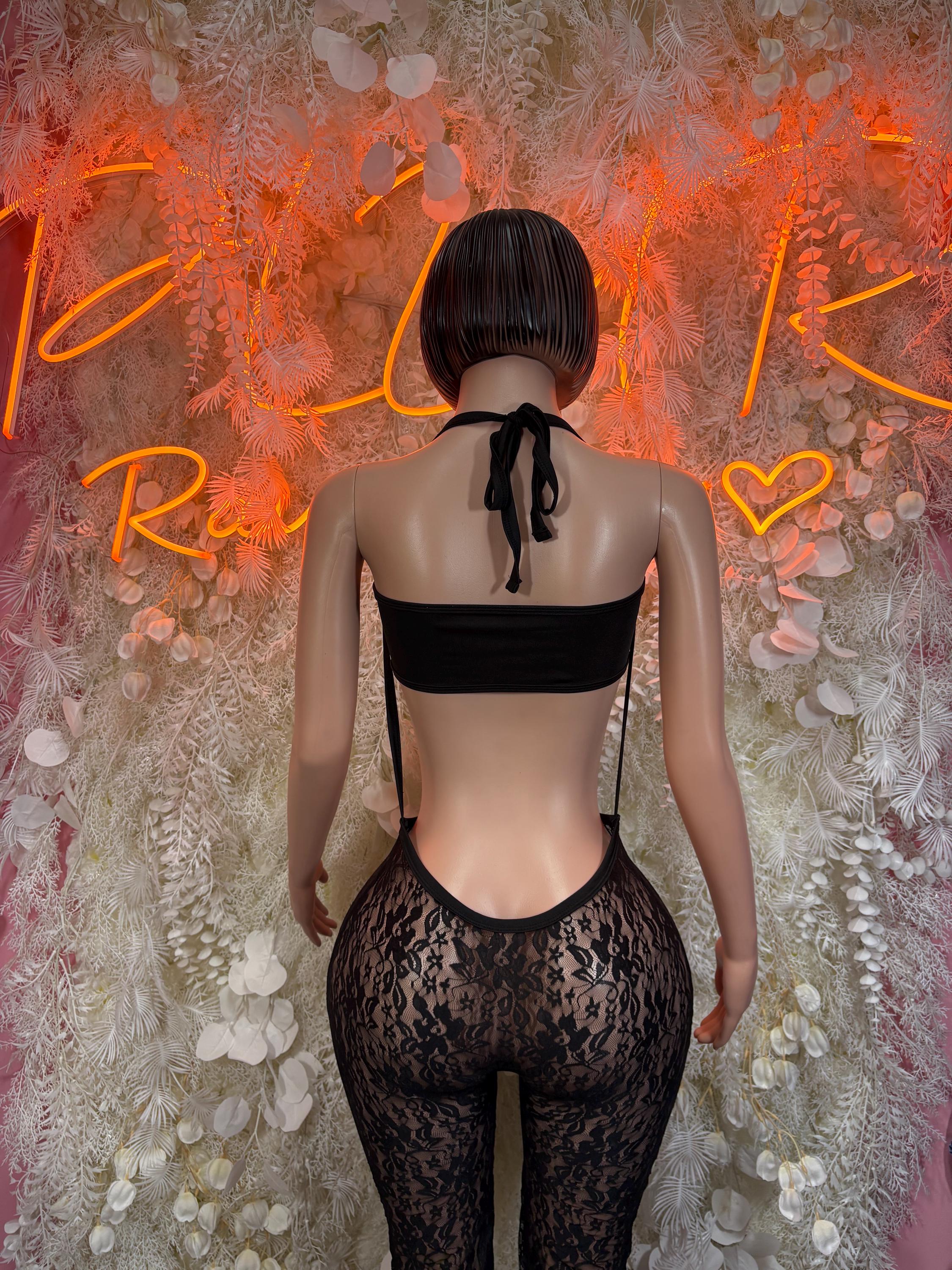 Black fishnet bodysuit back view with tie at neck and lace high-waist legs