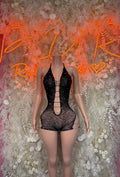 Fishnet black one-piece bodysuit with front lace-up strappy neckline, short legs