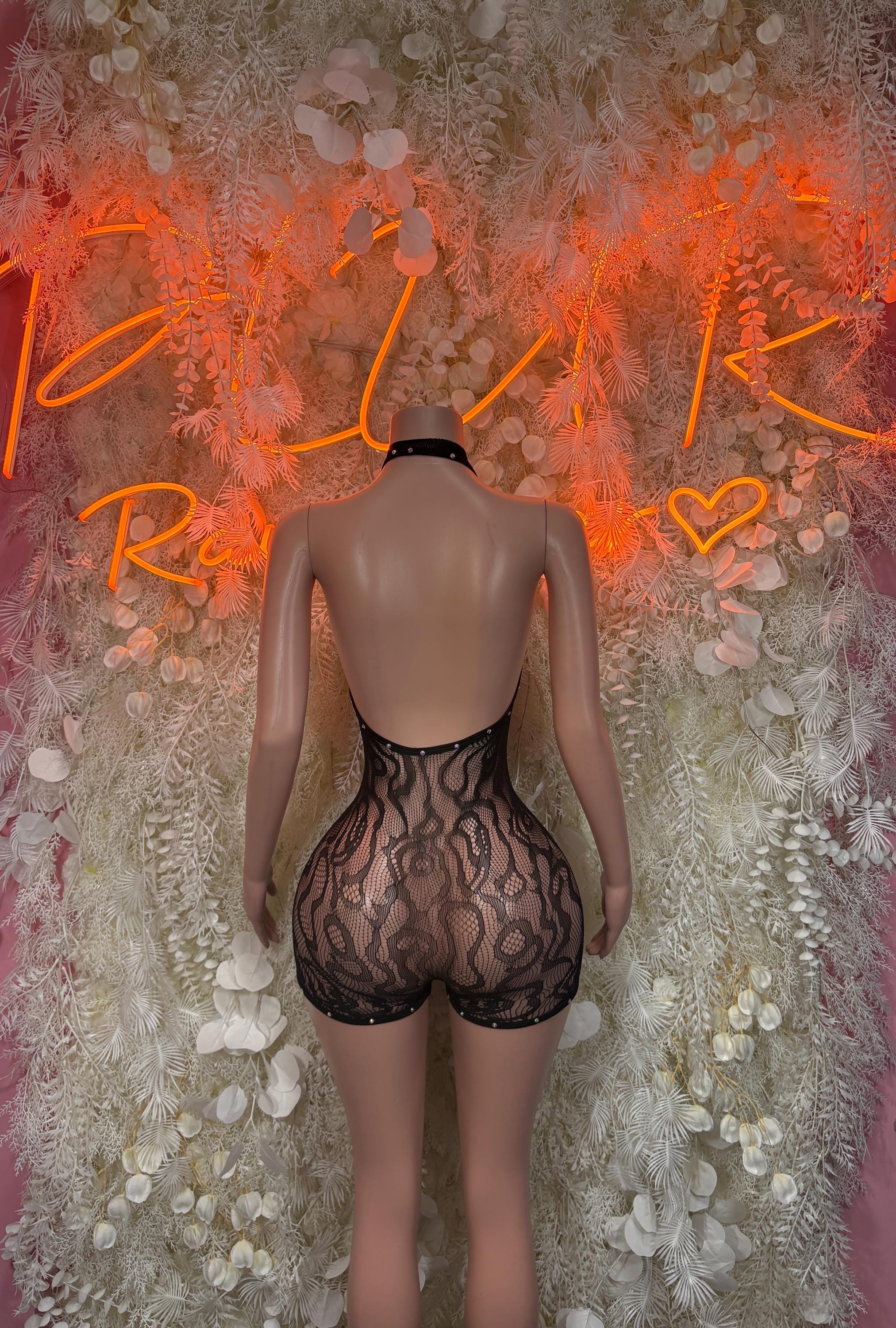 Black high-neck fishnet romper with short legs, open back