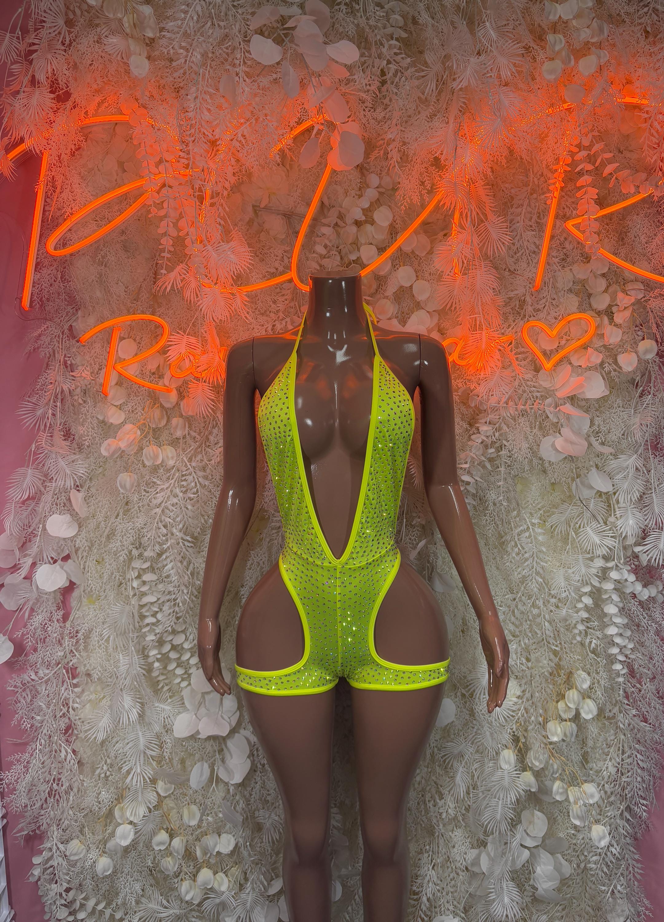 Neon green one-piece bodysuit with scoop neck and cutout side panels