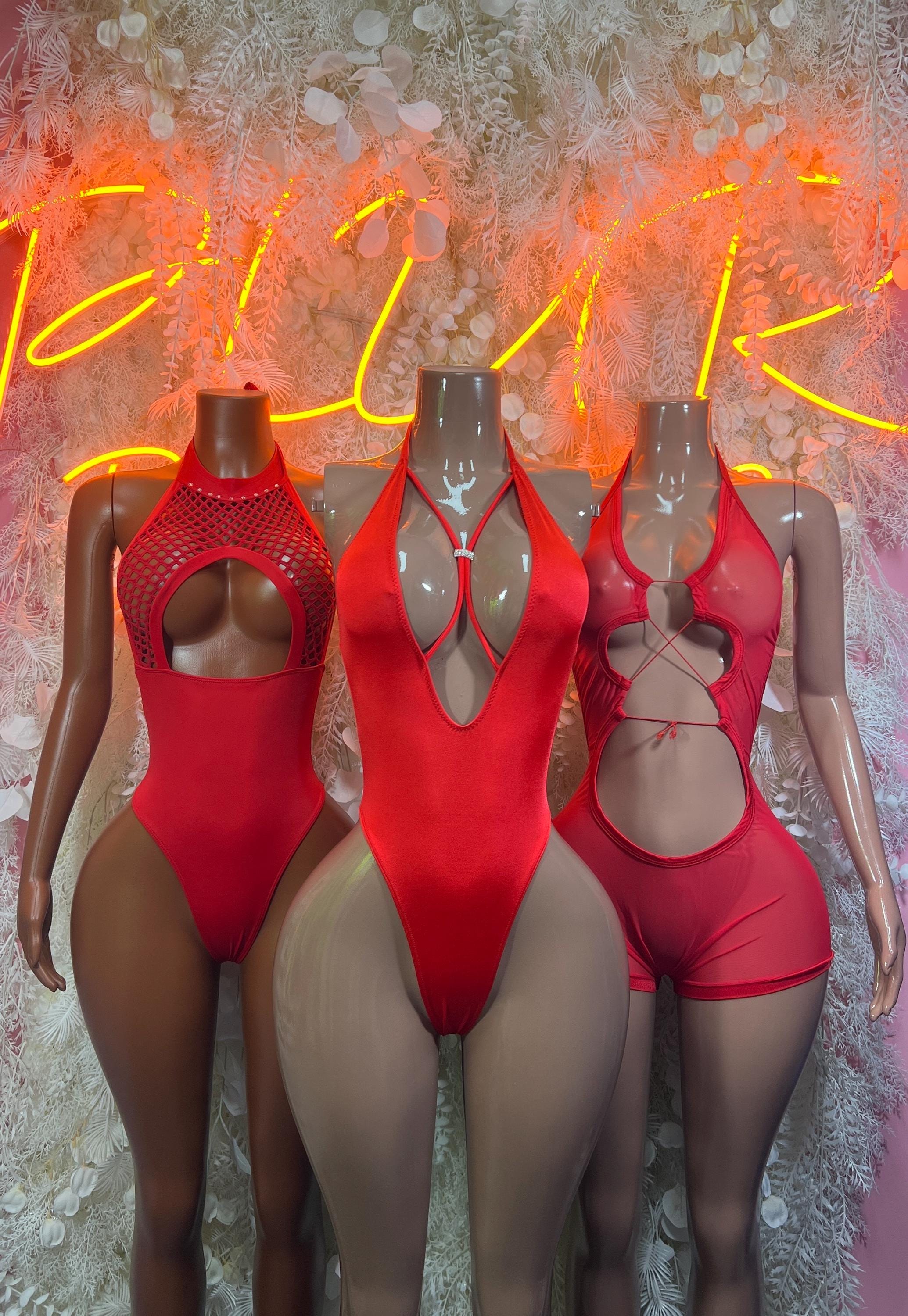 Red fishnet bodysuit one-piece with multiple cutouts and high-cut legs