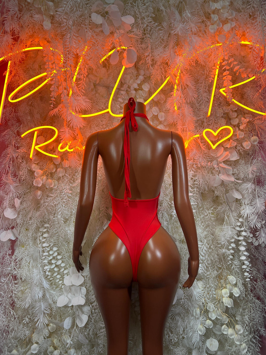 Red fishnet bodysuit one-piece with halter back straps and high-cut leg