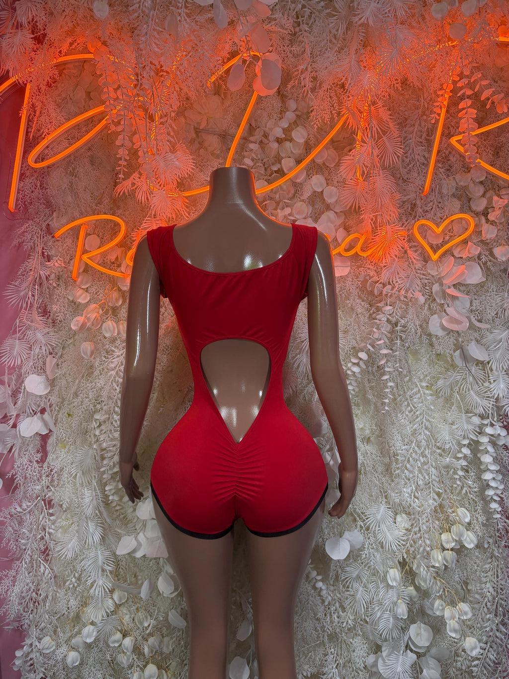Red fitted bodysuit with scoop neckline and front keyhole cutout, short romper