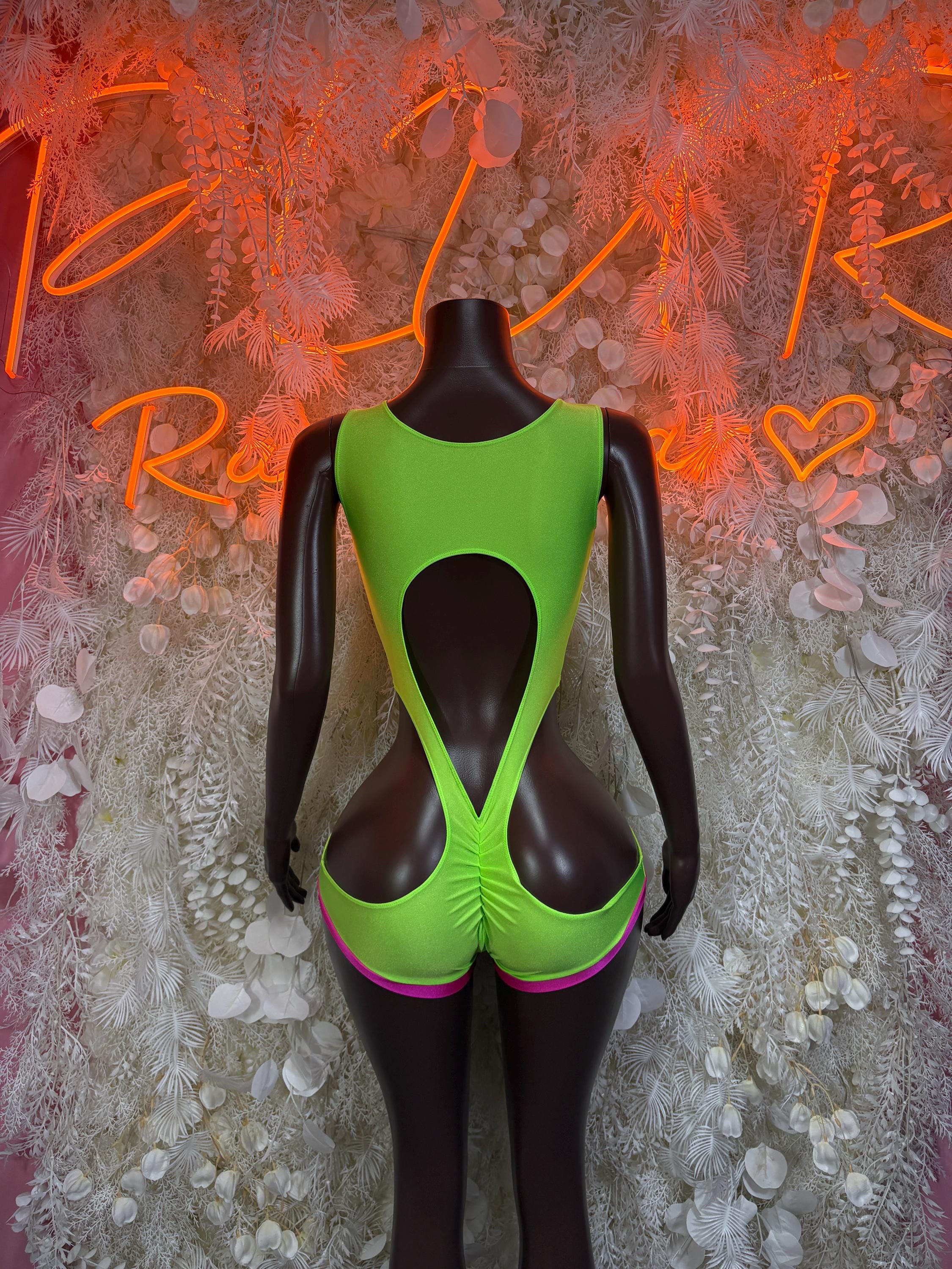 Green backless rave bodysuit with pink trim and large central cutout