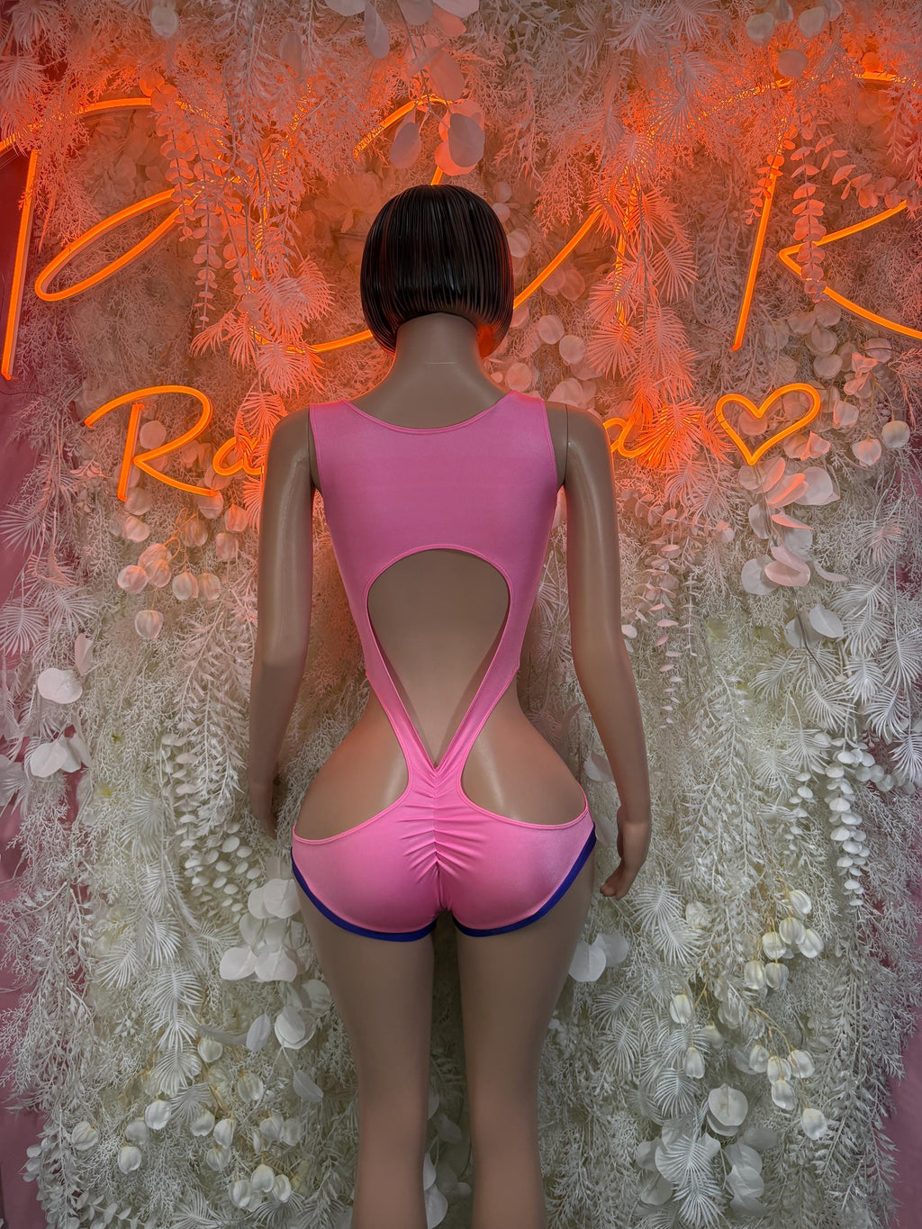 Pink and purple rave bodysuit, open back with cutout and strap-back design.