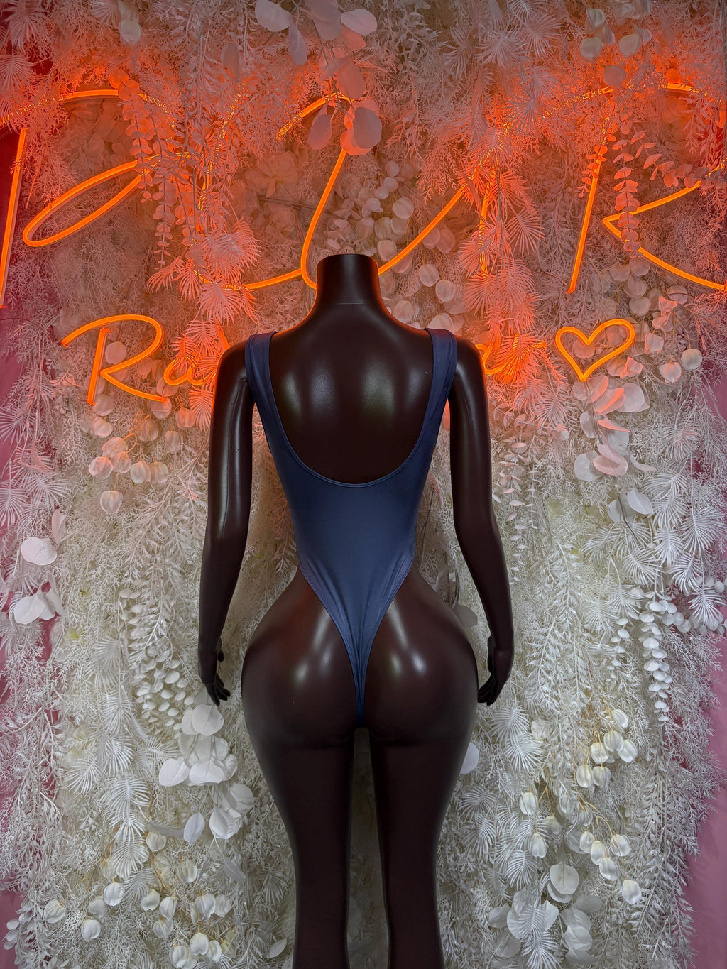 Blue one-piece rave bodysuit, open backless design with oval cutout at waist
